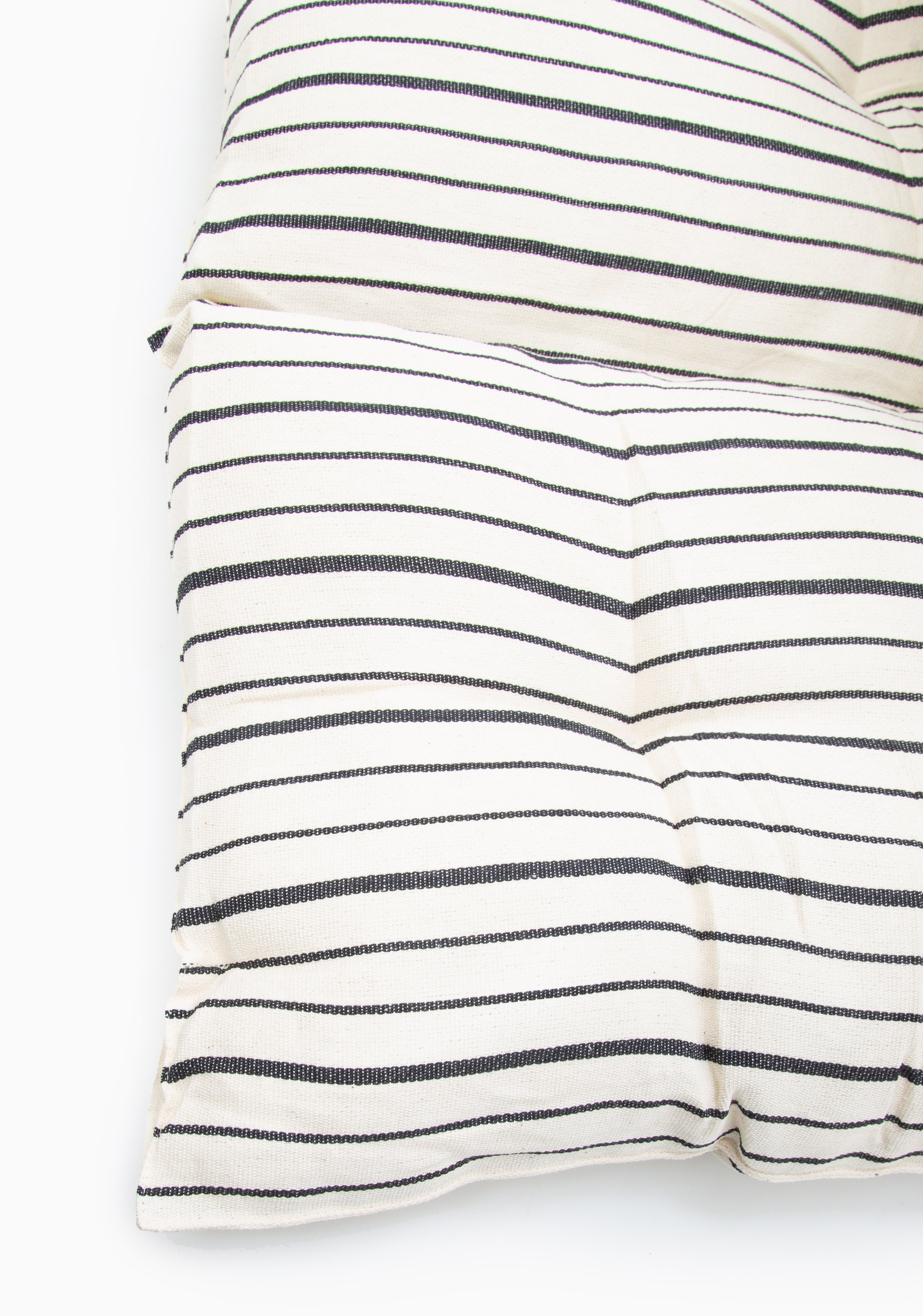 Handwoven picnic bed roll in earthy tones, crafted from 100% cotton by artisans in Guinea for the DIANI x Tensira collaboration.