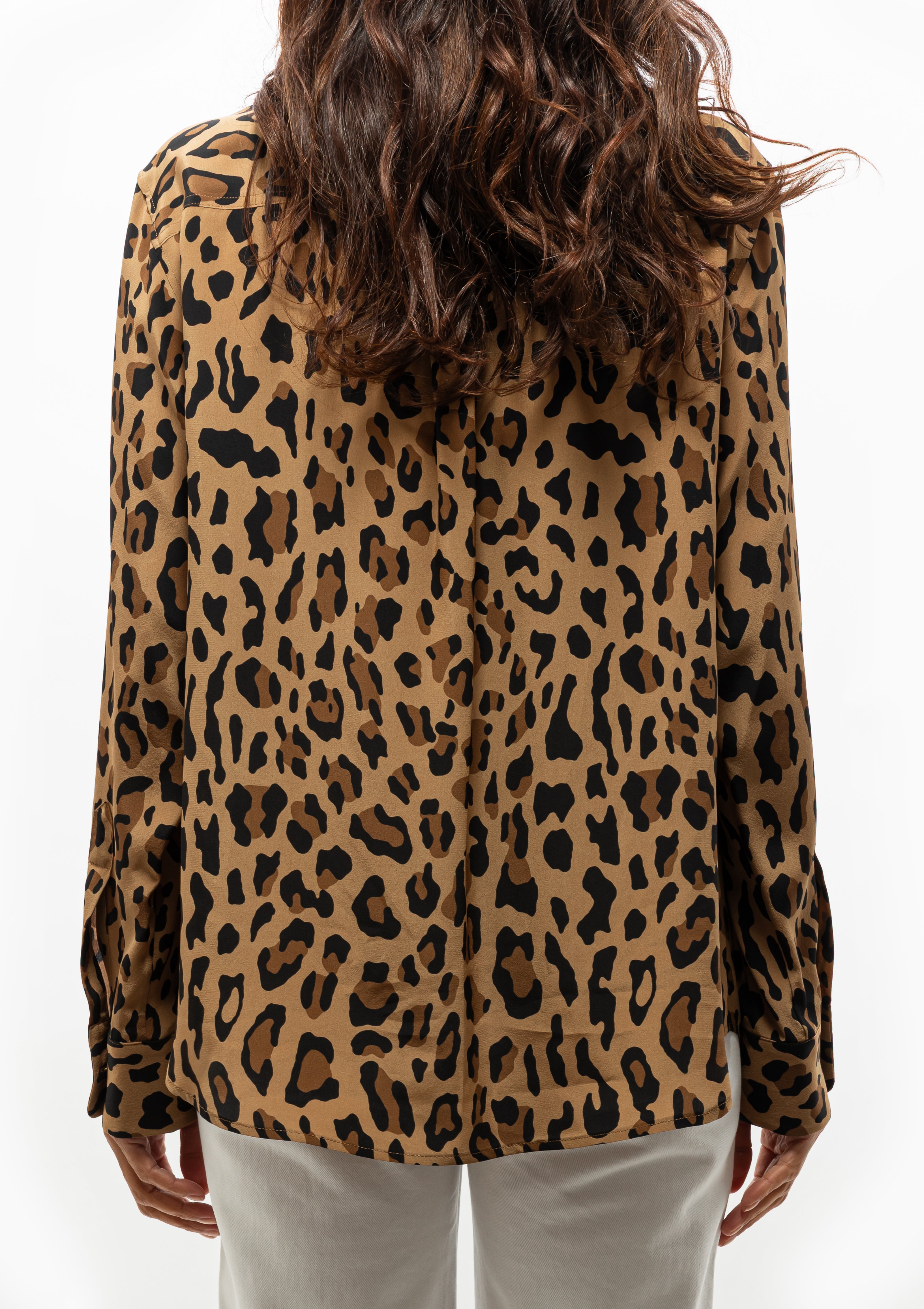 Blaze Milano’s Simba print shirt styled with crisp Clapots White Paso Jean, both available at Diani Boutique.