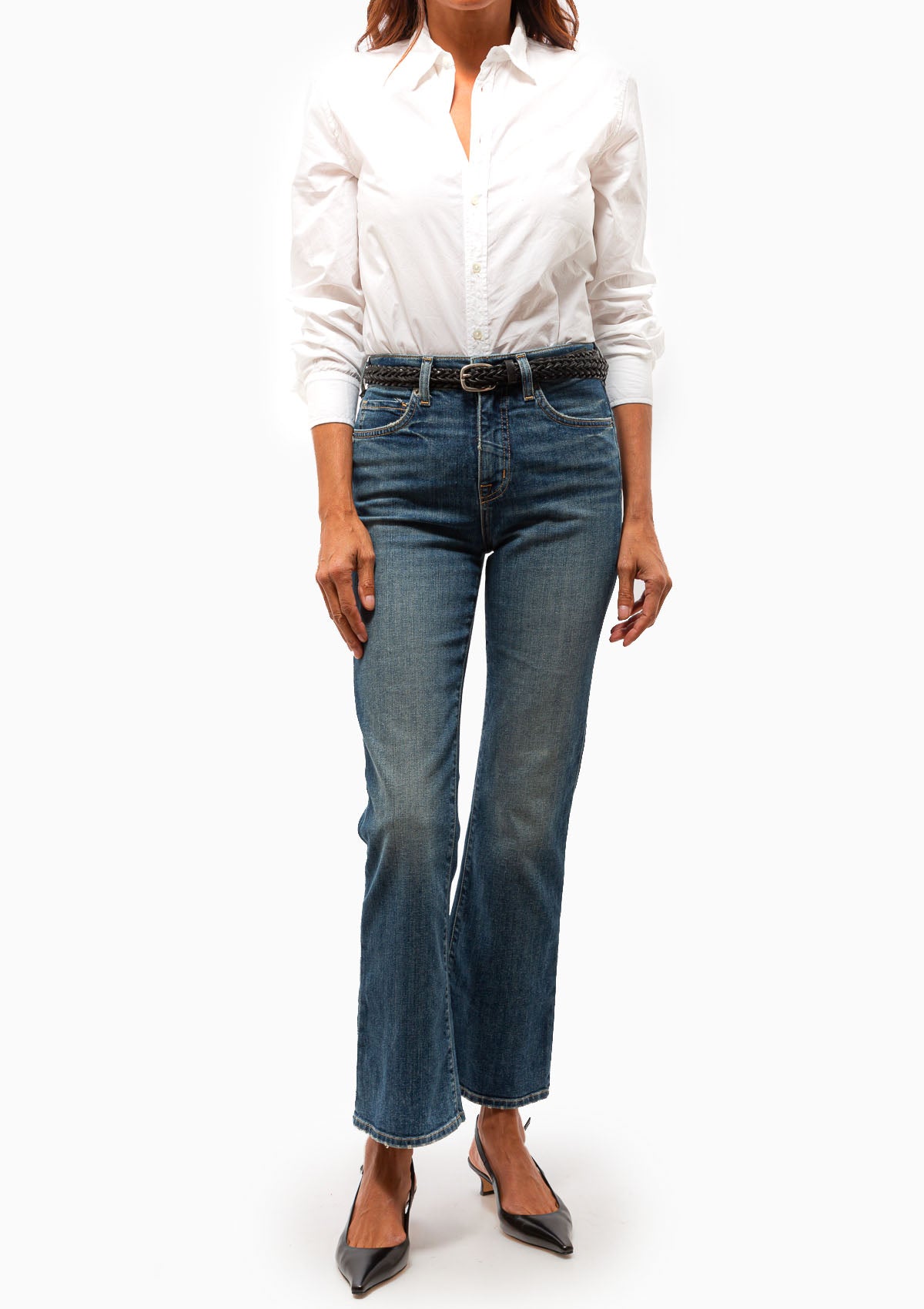 The Boot Cut Jean in Classic Wash. Shown with a white blouse. Available at Diani.