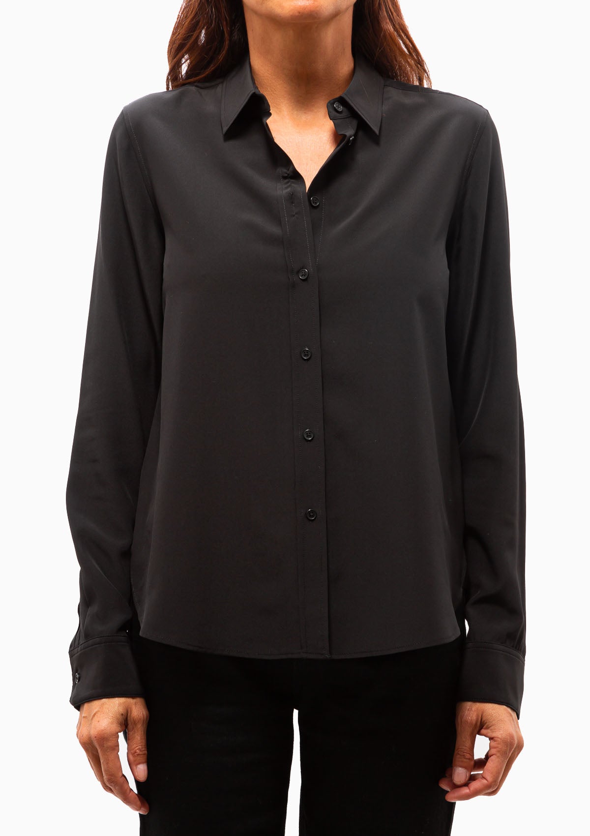 The Gaia Silk Slim Shirt in Black with black buttons. Available at Diani.