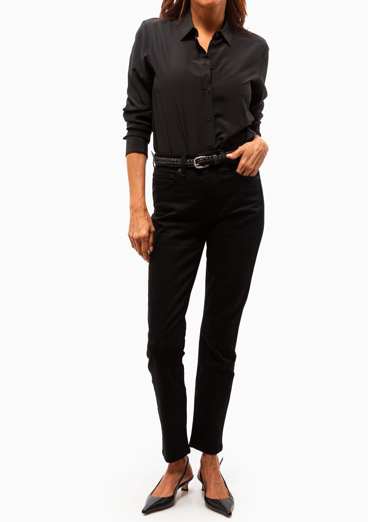 The Gaia Silk Slim Shirt in Black. Shown with black trousers. Available at Diani.