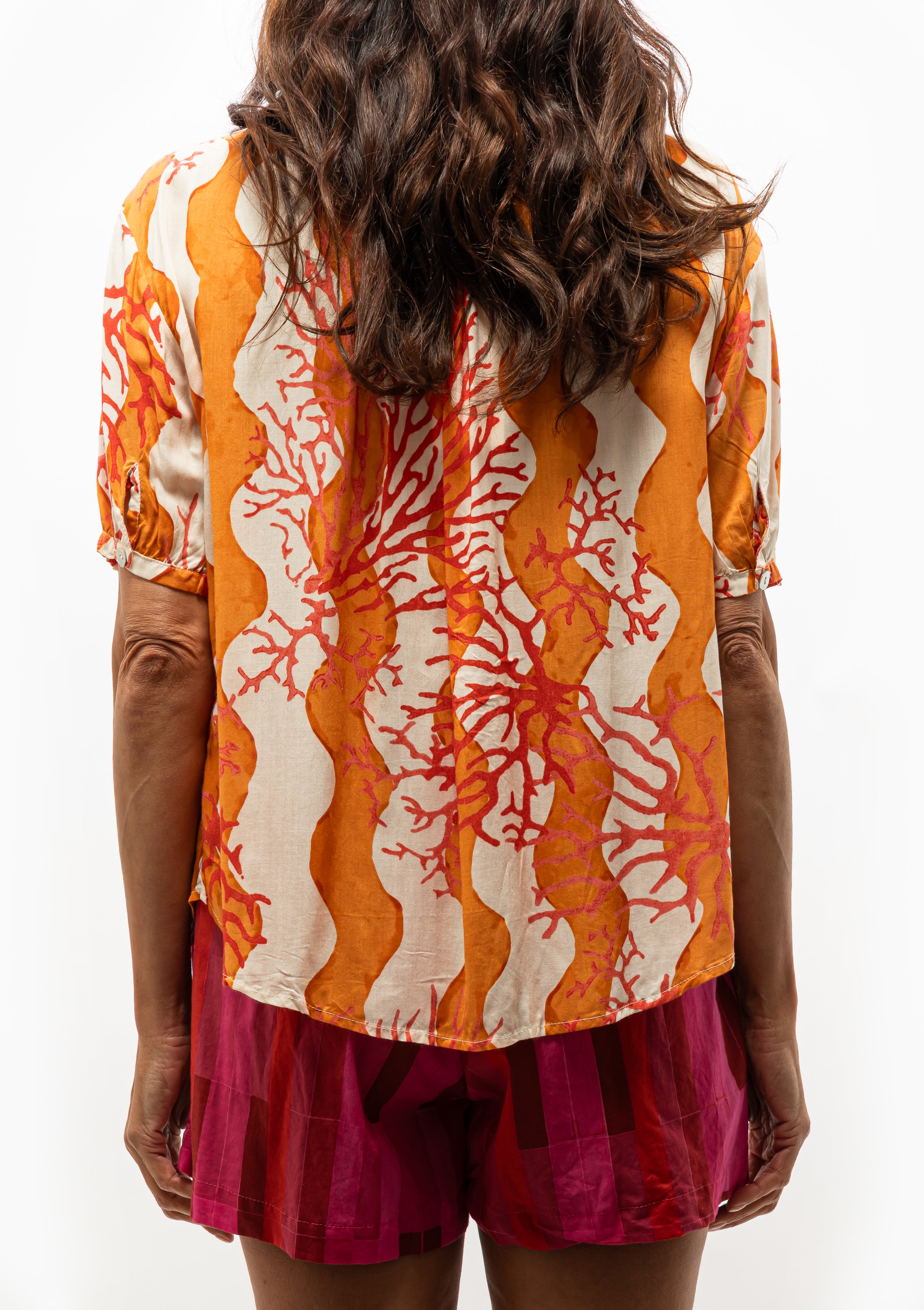 Flowy Coral Honey Wave Top by Natalie Martin with soft texture — available at Diani Boutique.