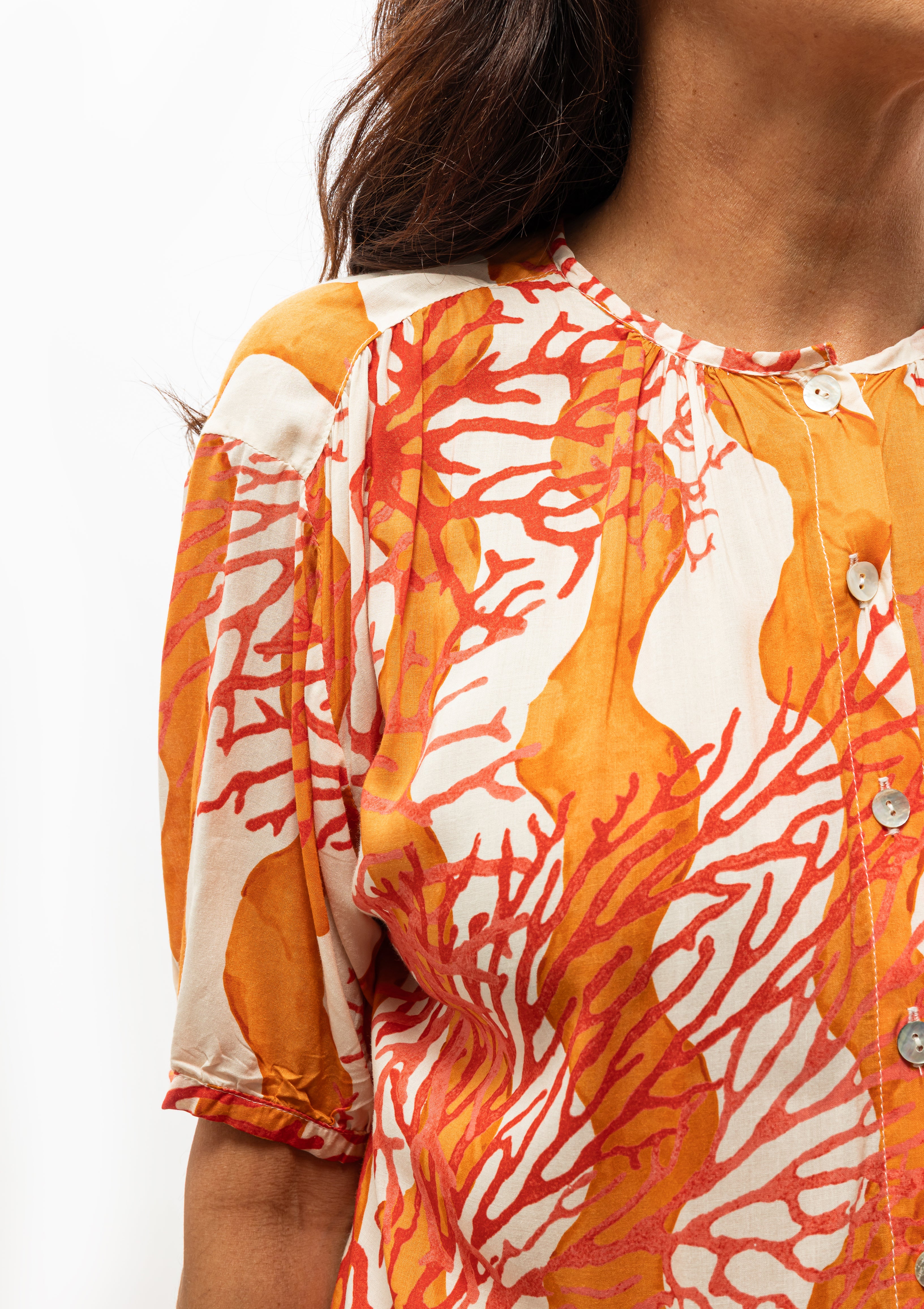 Effortless style in the Natalie Martin Coral Honey Wave Top — now at Diani Boutique.