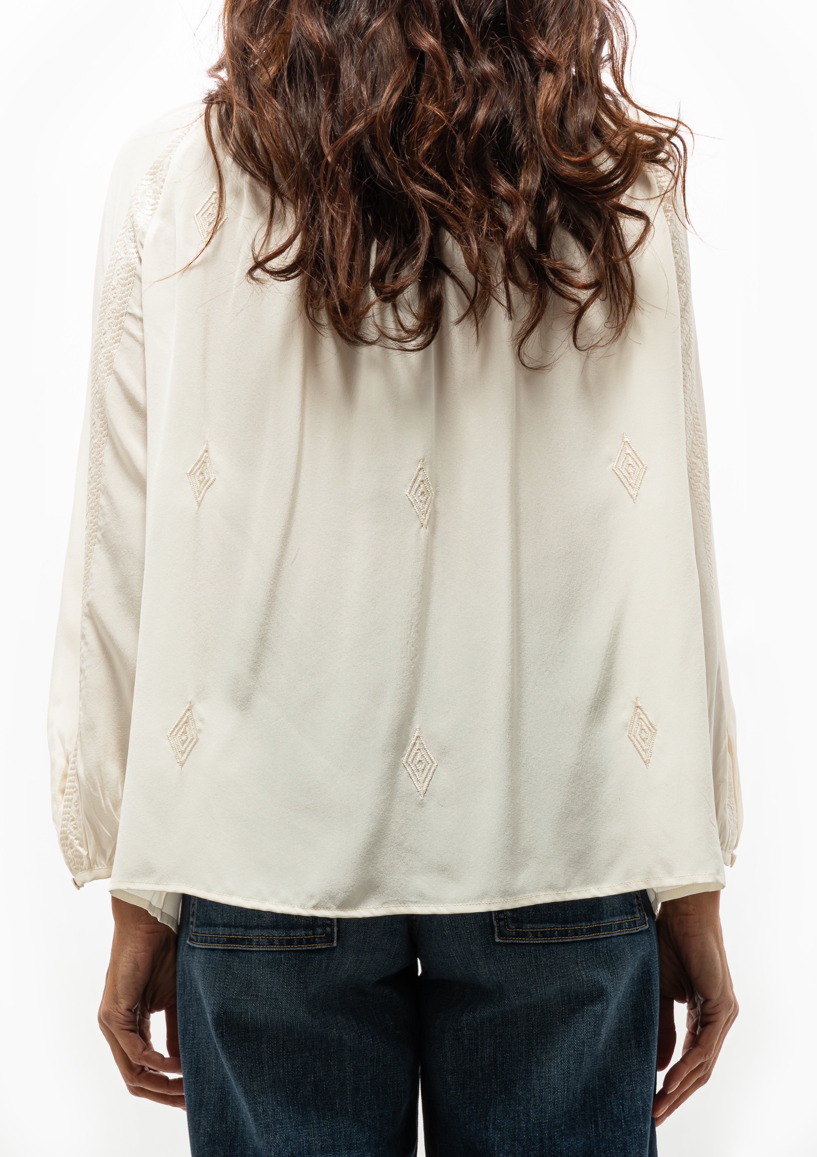 Timeless ivory silk Cristo Blouse by Nili Lotan, perfect for elevated looks — available at Diani Boutique.