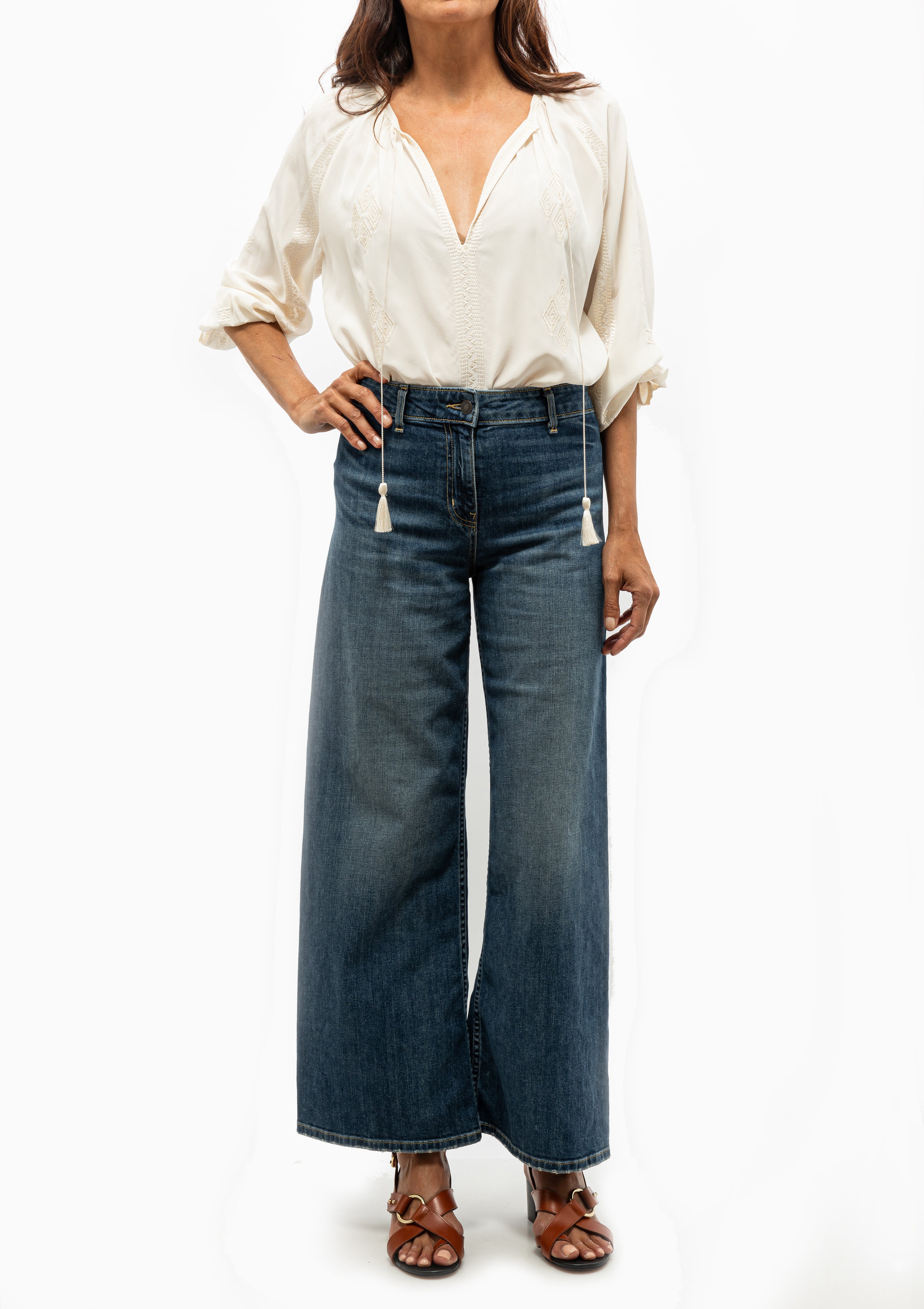 Nili Lotan Cristo Silk Blouse in Ivory featuring tonal Indian embroidery and delicate tassel ties, shown with the Nili Lotan Megan Jean — available at Diani Boutique.