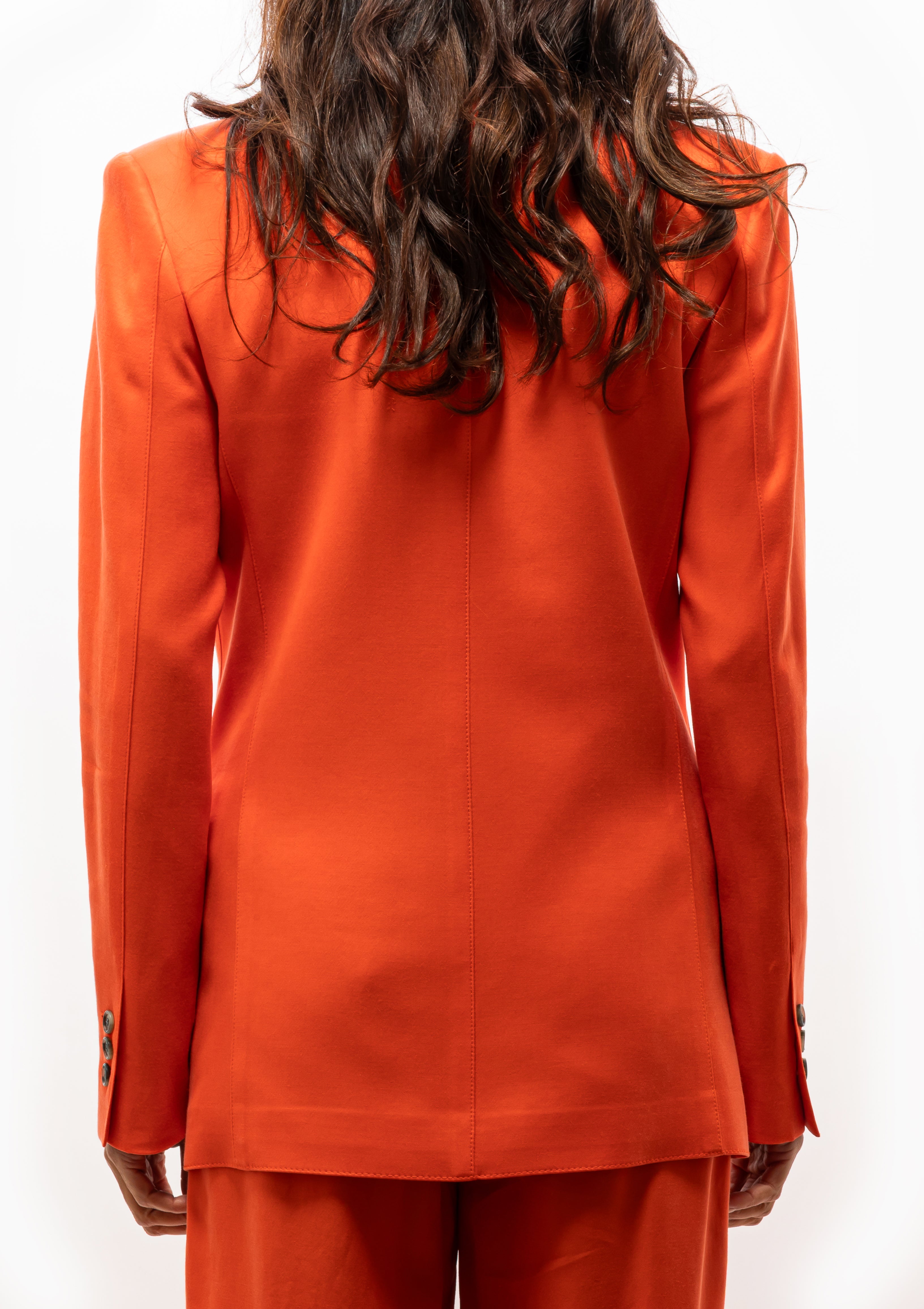 Stylish Smythe 90's Blazer in Vermillion orange suit with rolled-up sleeves and single-button closure. Available at Diani Boutique.