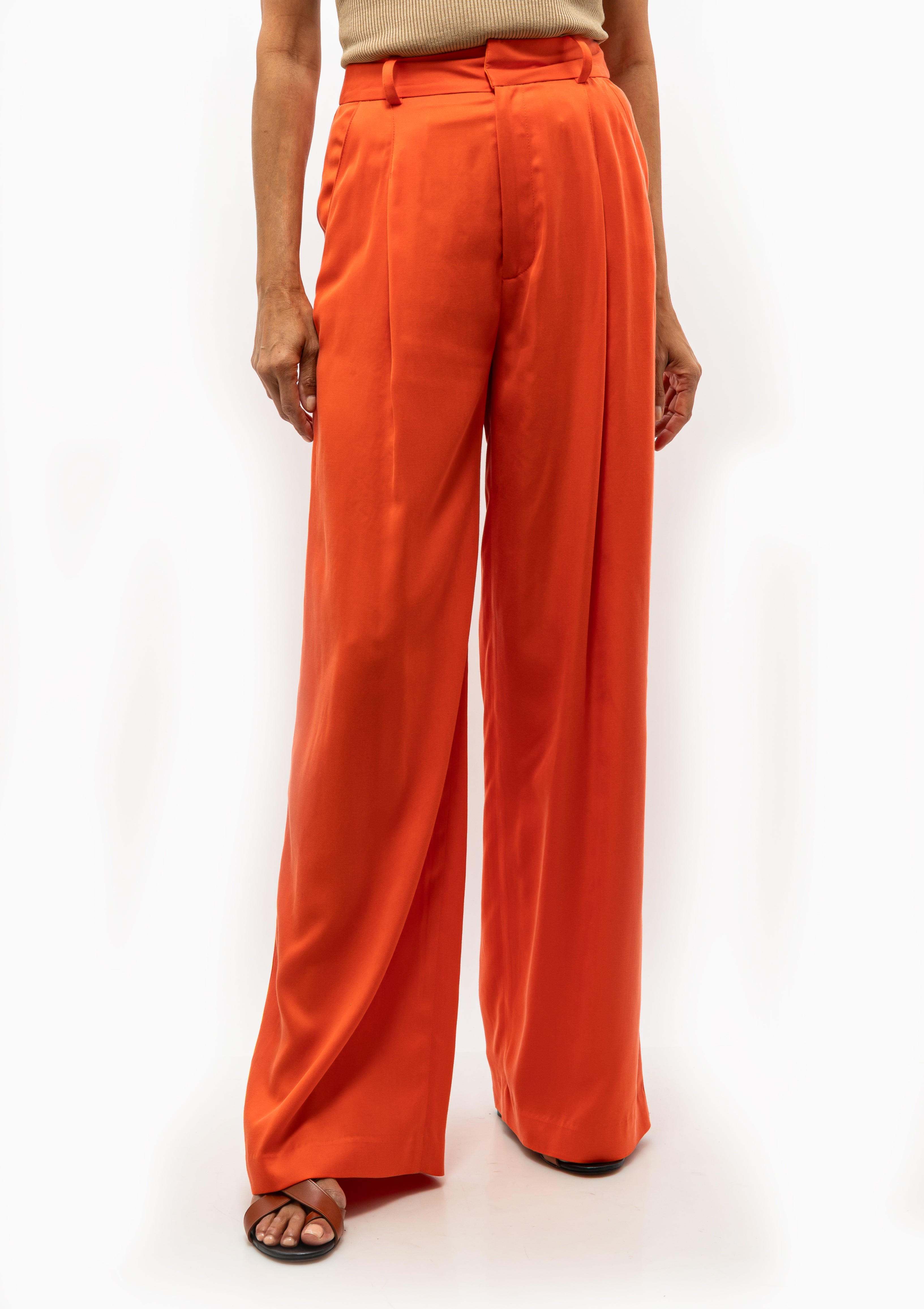 High-waisted Smythe Pleated Trouser in vermillion with pleated front detail. Available at Diani Boutique.