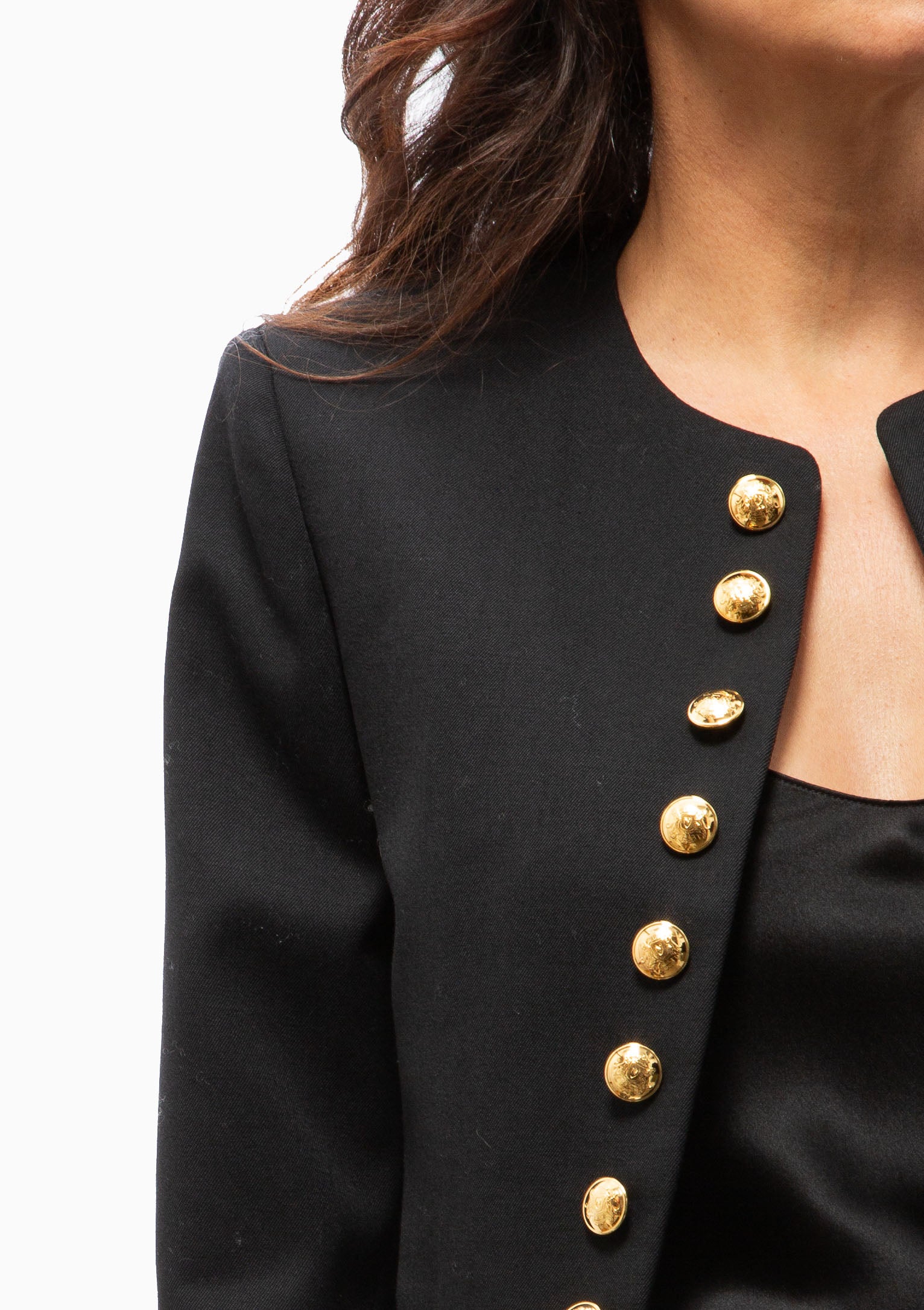 Close up of the Nili Lotan Patti Short Jacket in Black with gold buttons. Available at Diani.