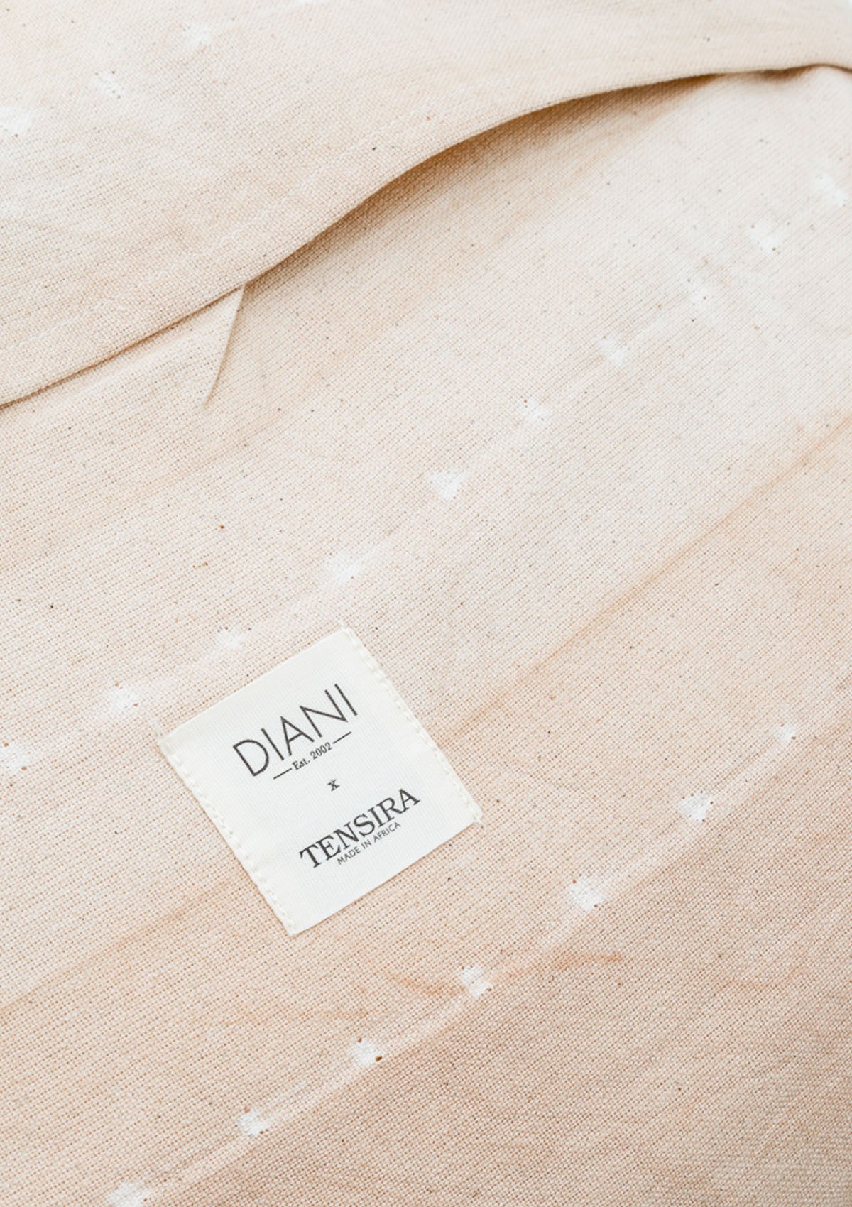 Artisan-crafted 20" x 20" pillow in a soft Sunkissed Pebble colorway, with barely-there stripes for a refined, organic look.