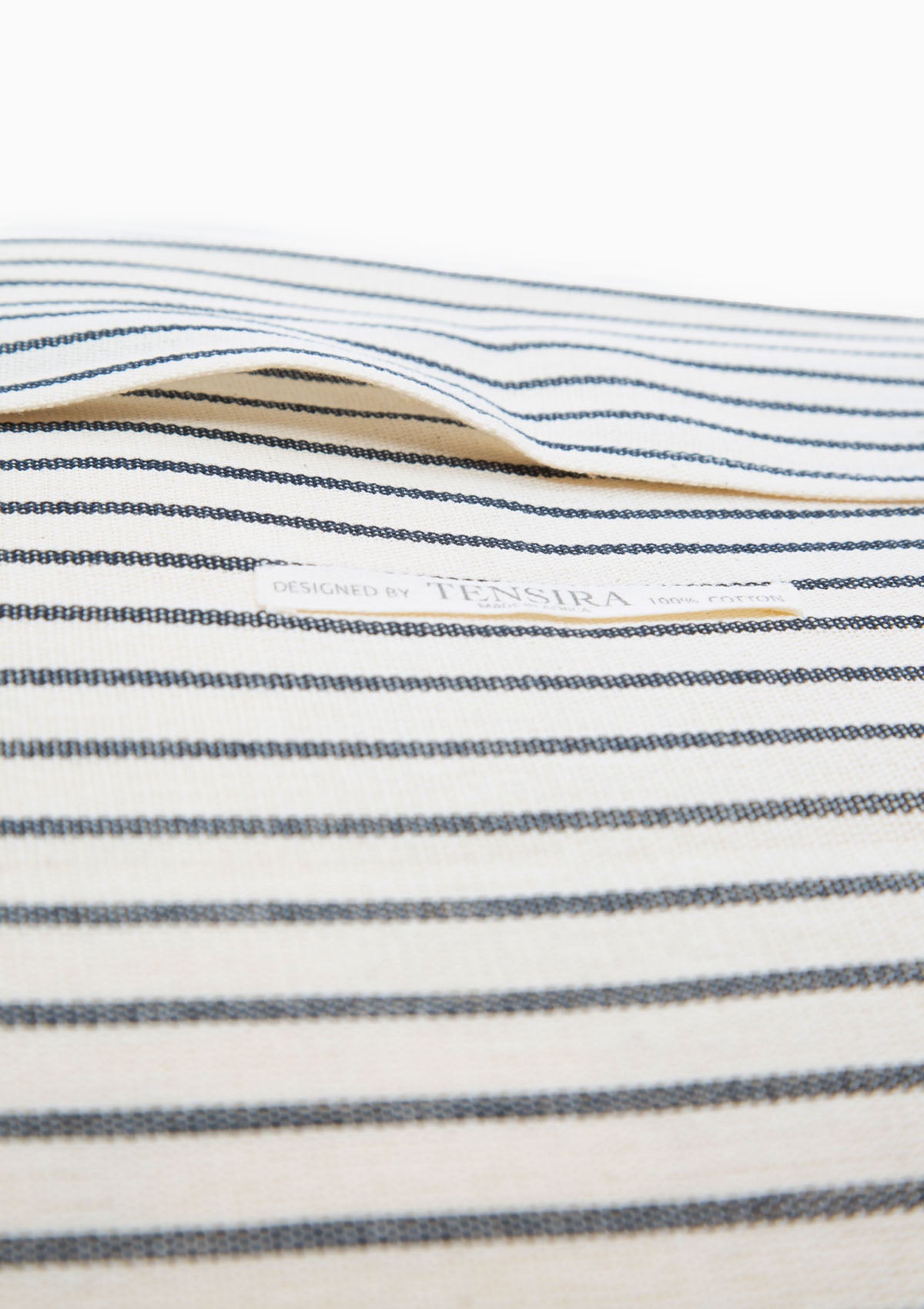 Diani Boutique exclusive square pillow in solid and striped designs, crafted with hand-dyed cotton by artisan groups in Guinea.