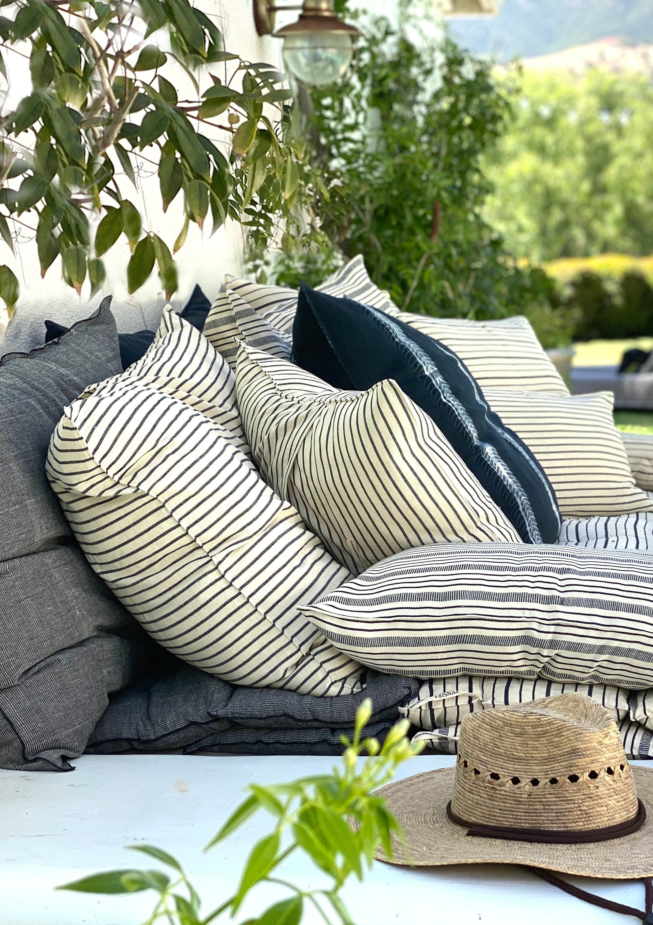 Cotton headboard cushion from Tensira X Diani, sustainably made in Guinea by artisan groups using zero-waste practices.