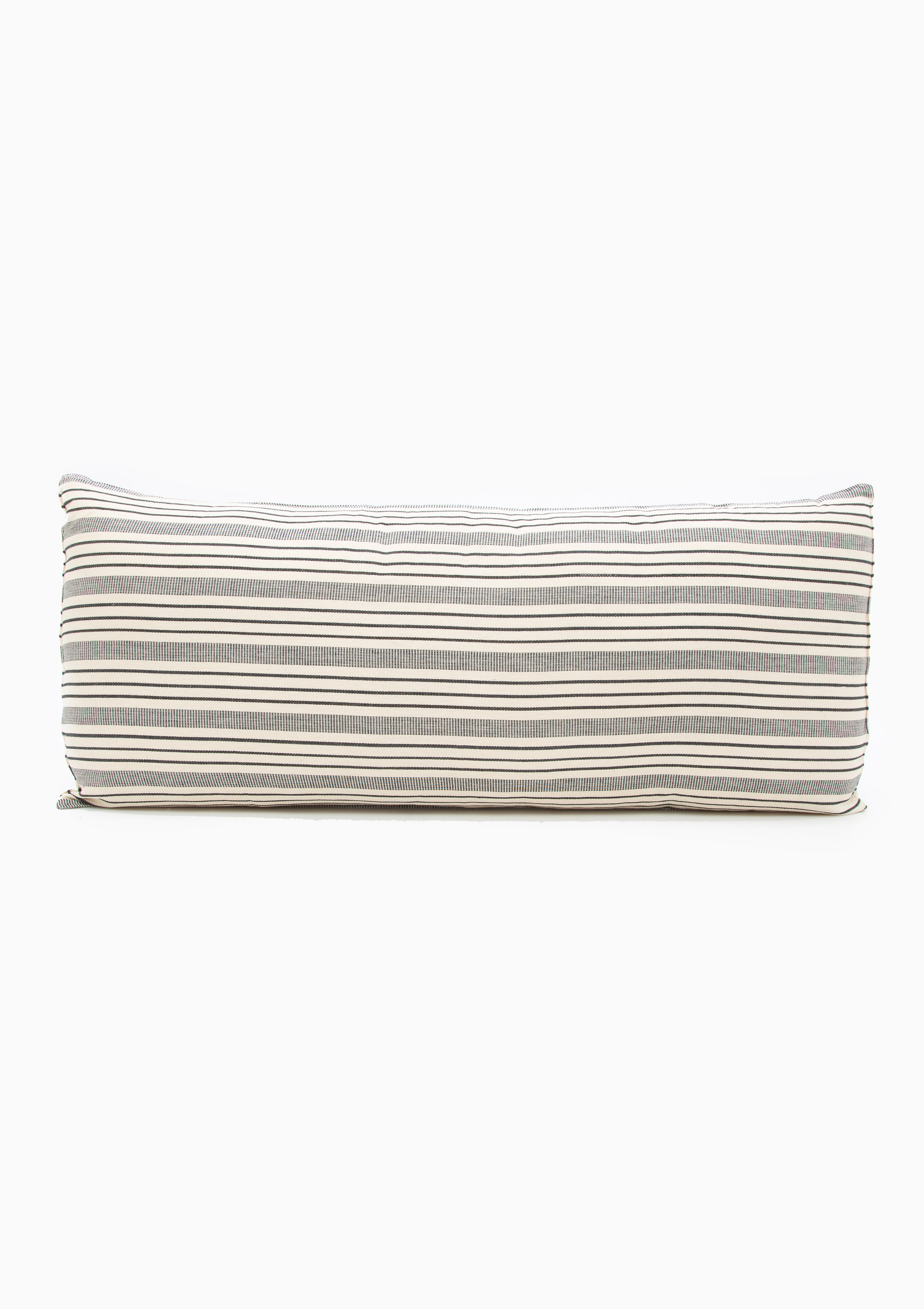 Tensira x DIANI long cushions with bold stripes, showcasing traditional West African textile craftsmanship.