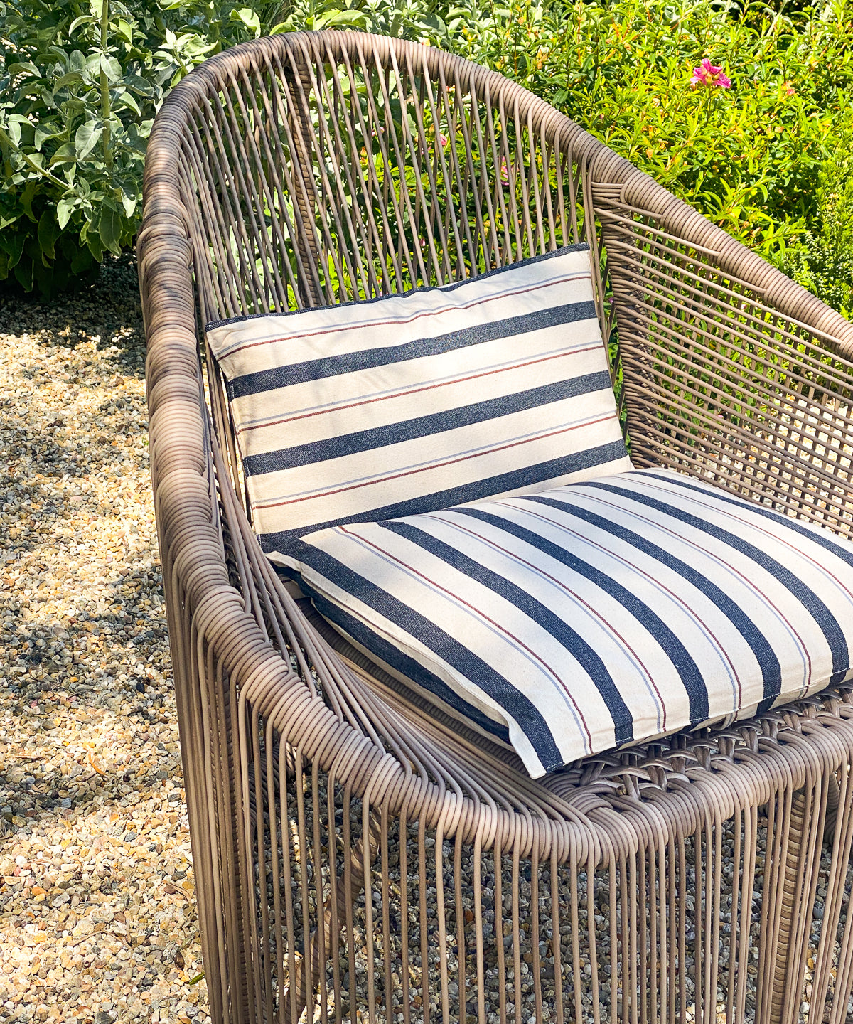Sustainably crafted 12" x 20" cushion in solid and striped designs, made from over 3,000 hand-dyed yarns using zero-waste methods for Diani Boutique.
