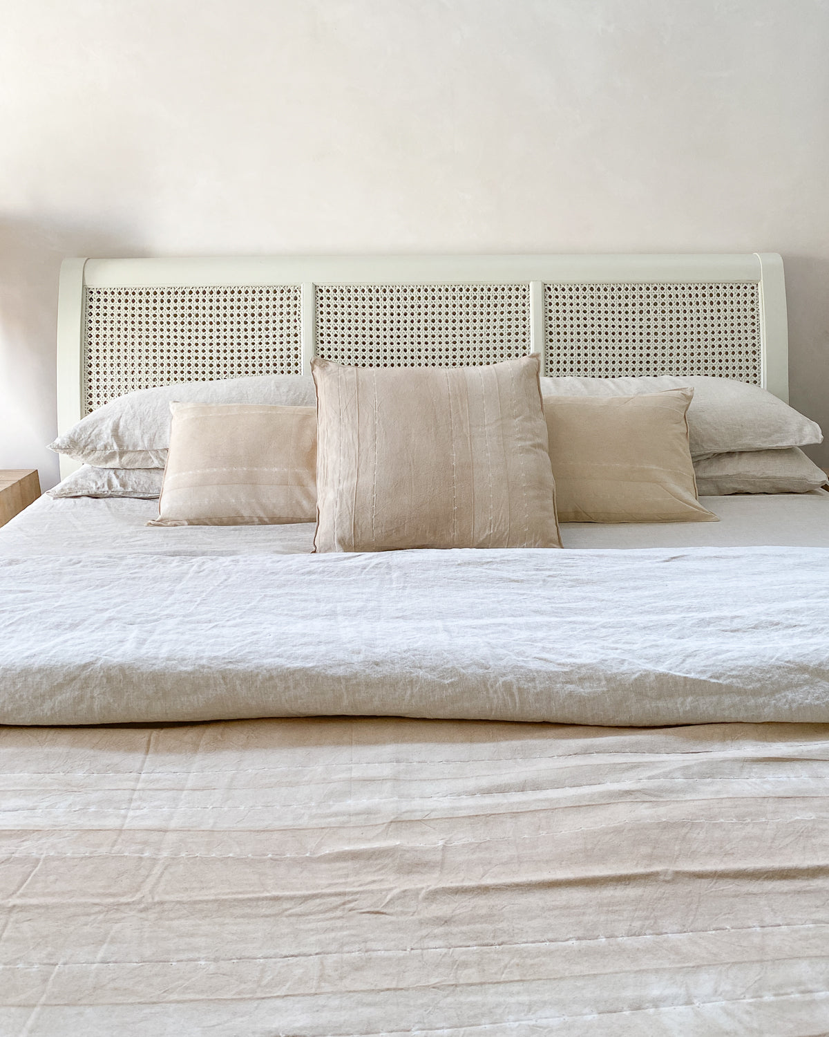 Artisan-crafted 20" x 20" pillow in a soft Sunkissed Pebble colorway, with barely-there stripes for a refined, organic look.