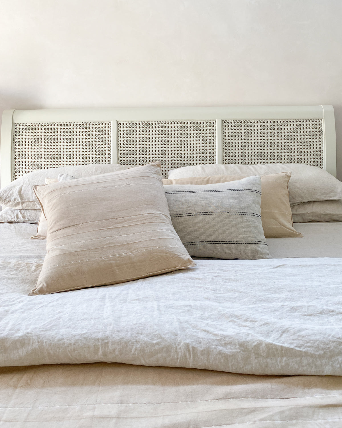 Elegant and minimal, this 20" x 20" cushion in Sunkissed Pebble features tonal stripes and natural cotton texture, made exclusively for Diani Boutique.