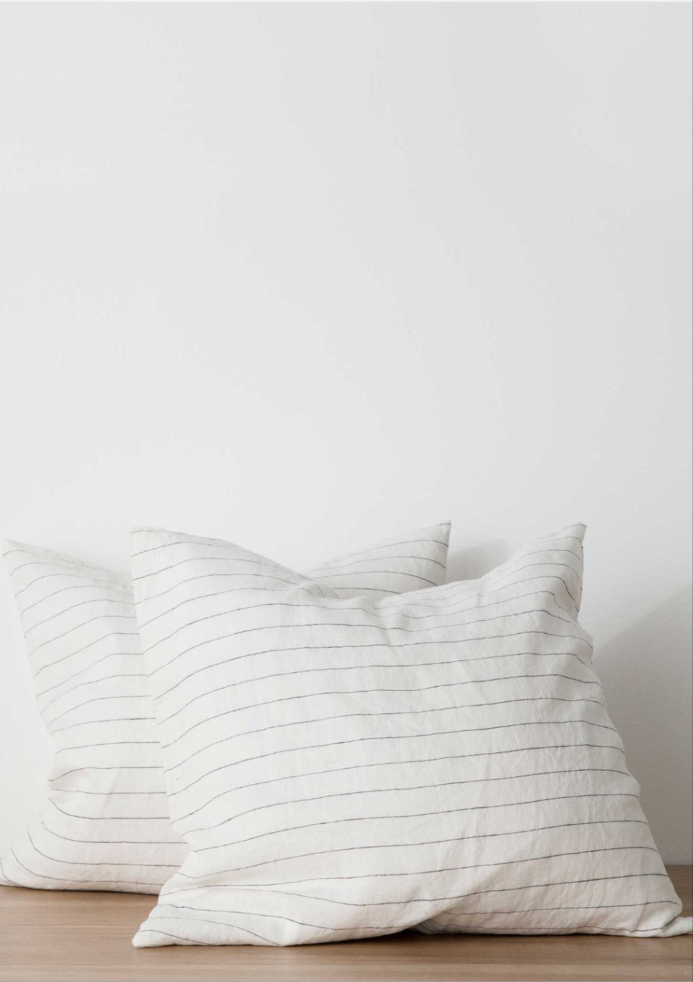 Cultiver Euro pillow case in natural pencil stripe linen, featuring a soft, textured weave and relaxed, breathable finish; effortlessly elegant bedding available at Diani.