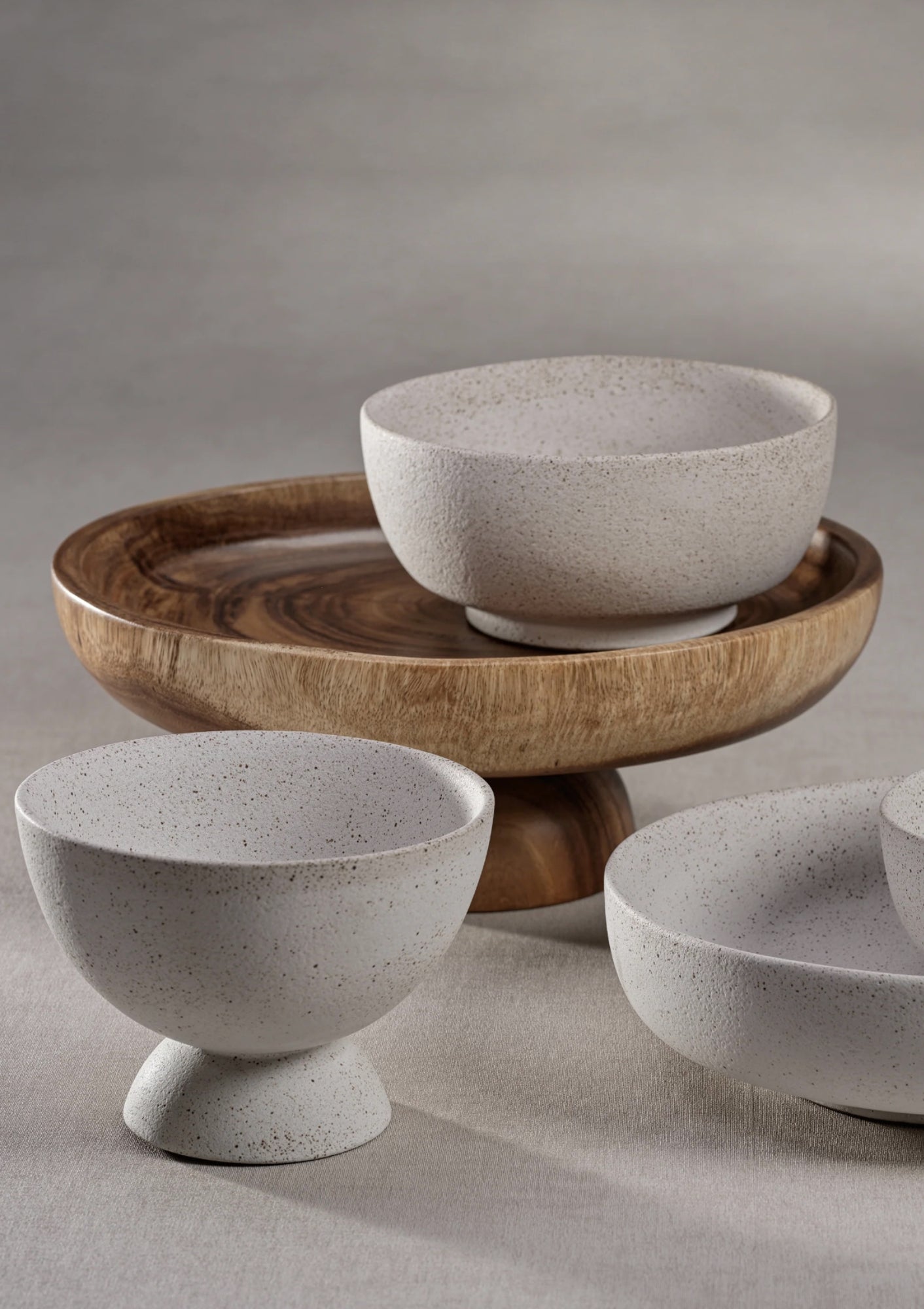 Javanese acacia wood pedestal serving bowl available at Diani.