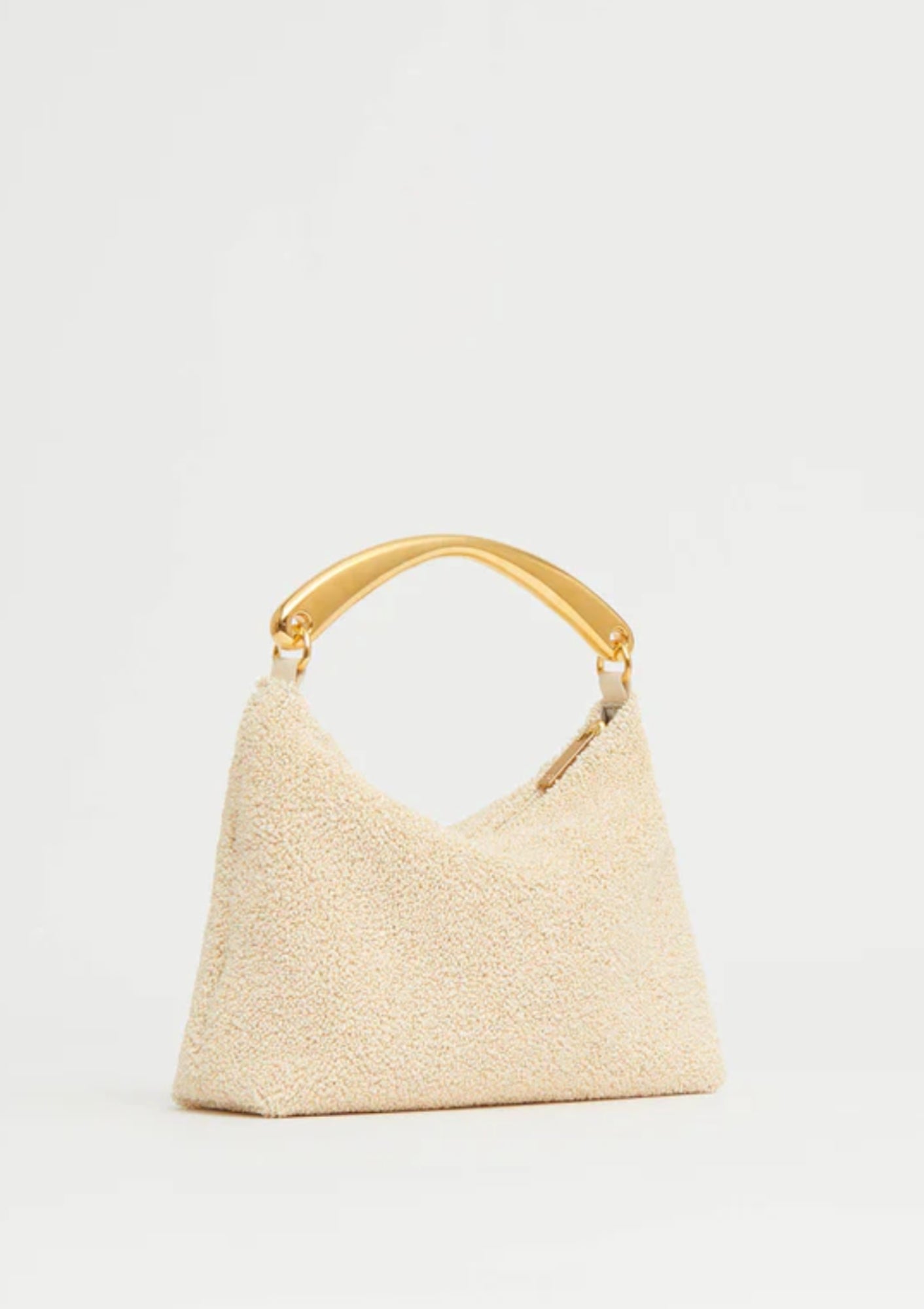 Jasmine yellow Mansur Gavriel Hera Clutch in textured raffia, shown with sculptural gold-tone metal handle; available at Diani, combining natural materials with elegant, modern design