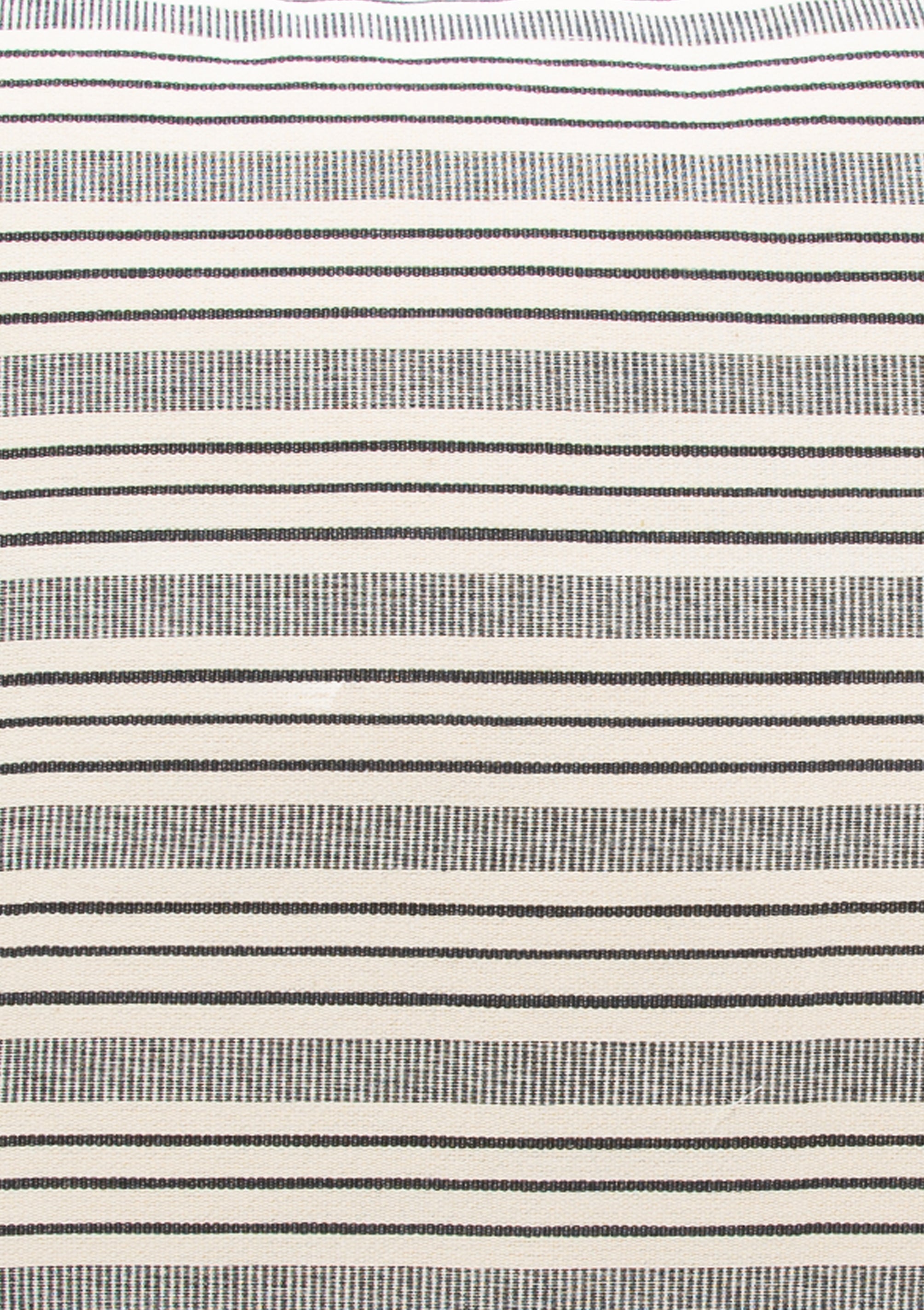 Closeup of our Tensira X Diani headboard cushion. Striped cotton, sustainably made in Guinea by artisan groups using zero-waste practices.