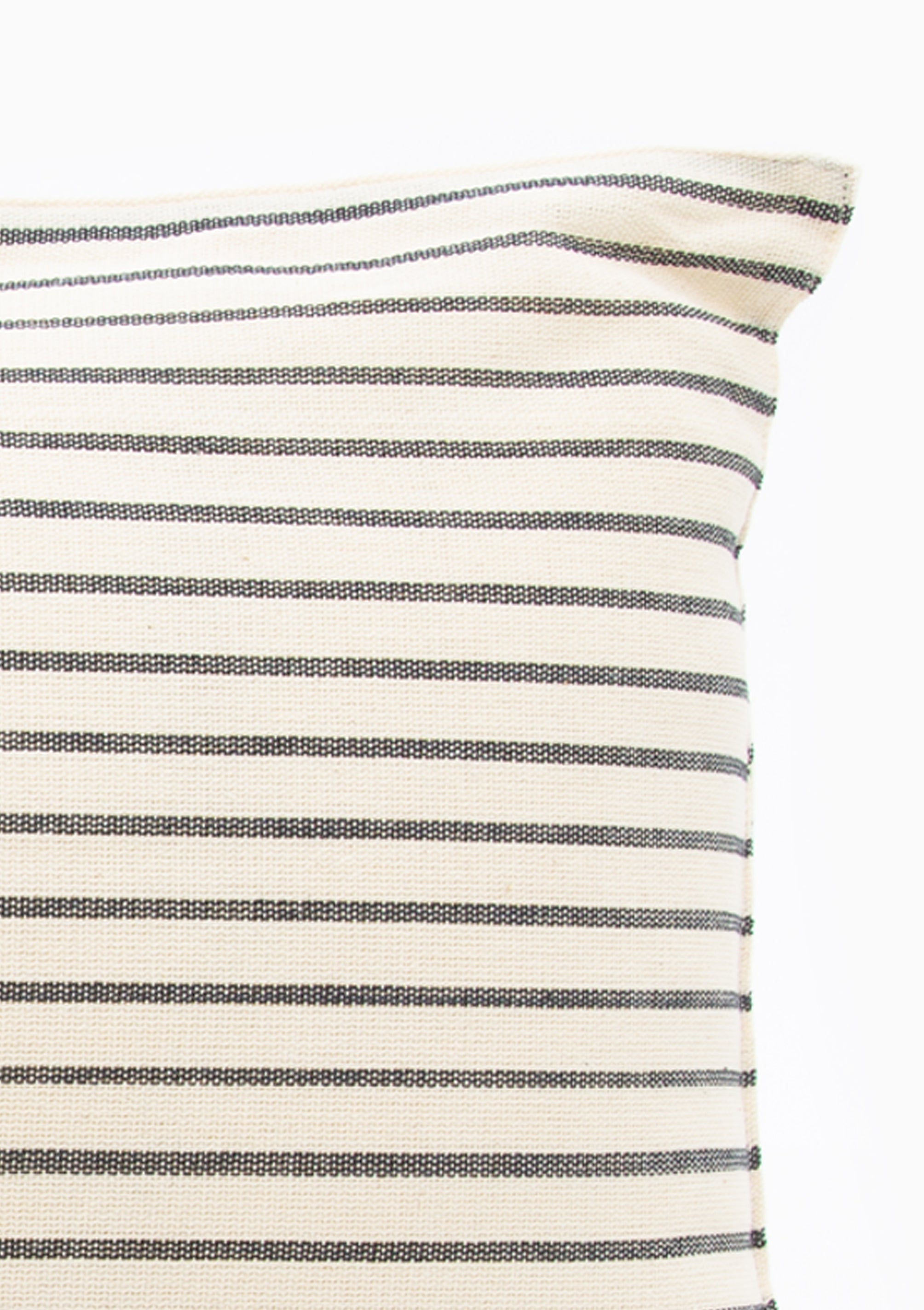 Solid and striped long cushions made from 100% handwoven cotton by Tensira, crafted using traditional looms and sustainable practices.