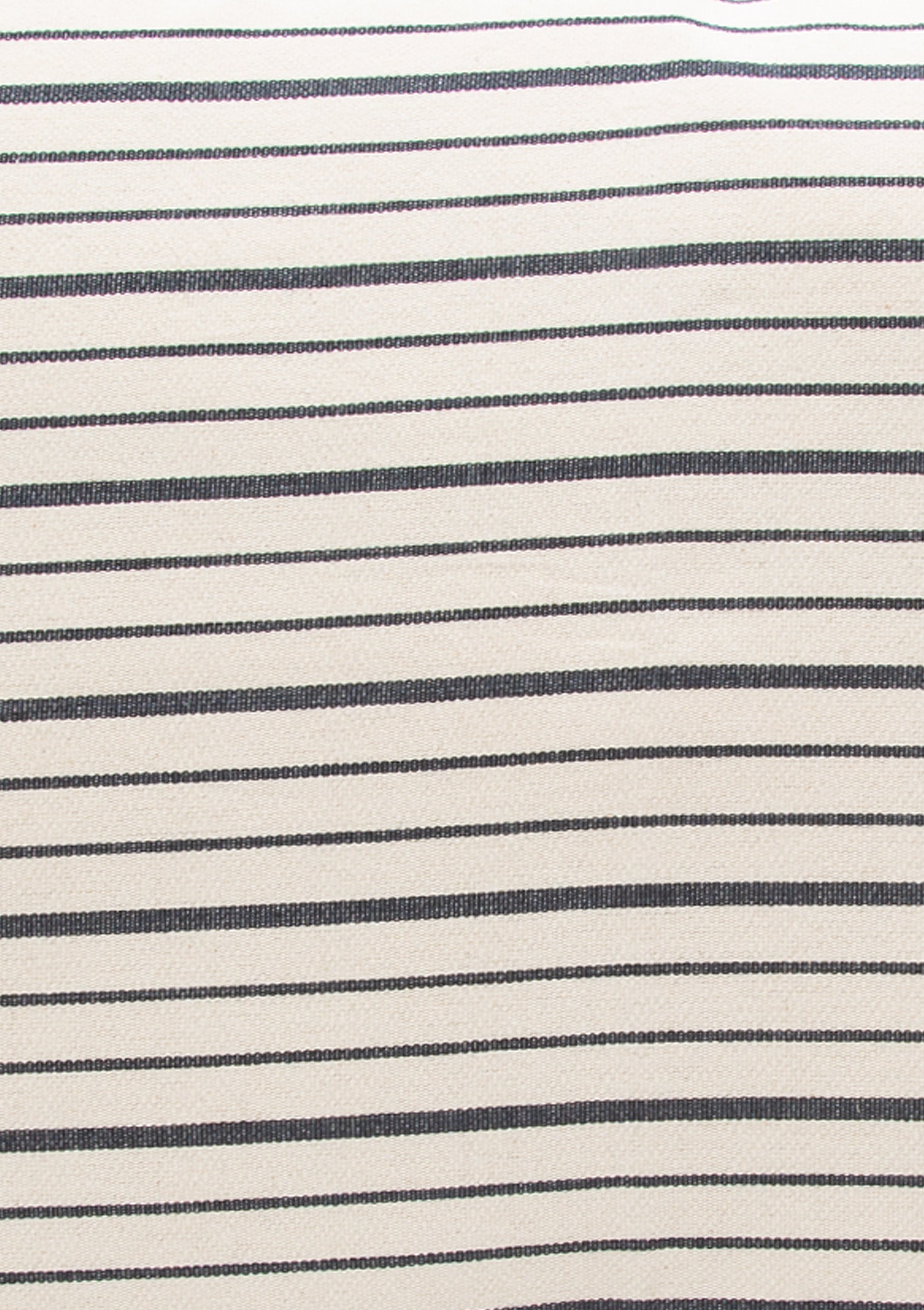 Close up of our striped cotton headboard cushion from Tensira, sustainably made in Guinea by artisan groups using zero-waste practices.