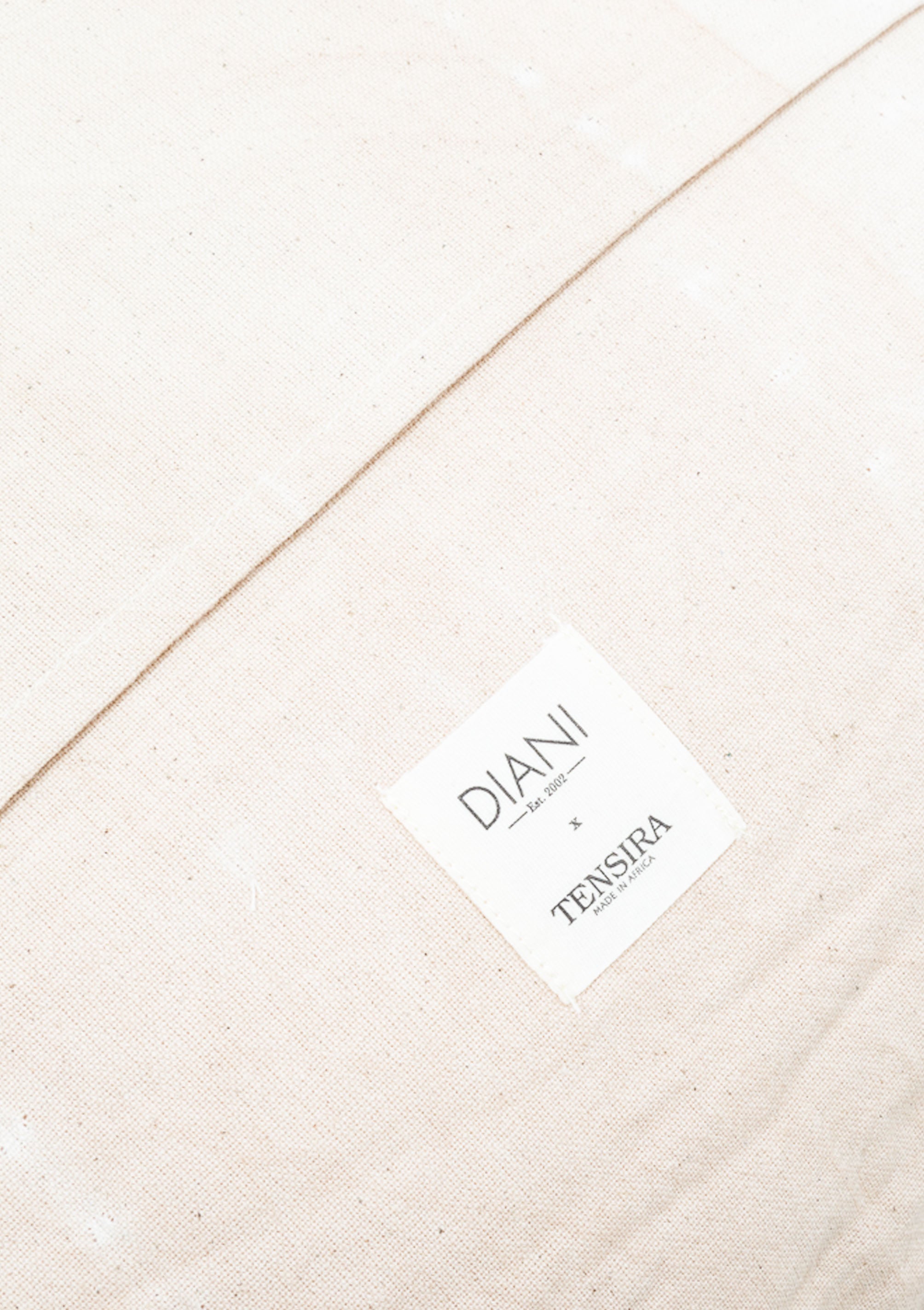 Handwoven 100% cotton headboard cushion by Tensira, crafted on traditional looms with over 3,000 hand-dyed yarns. Part of our Diani X Tensira collection.