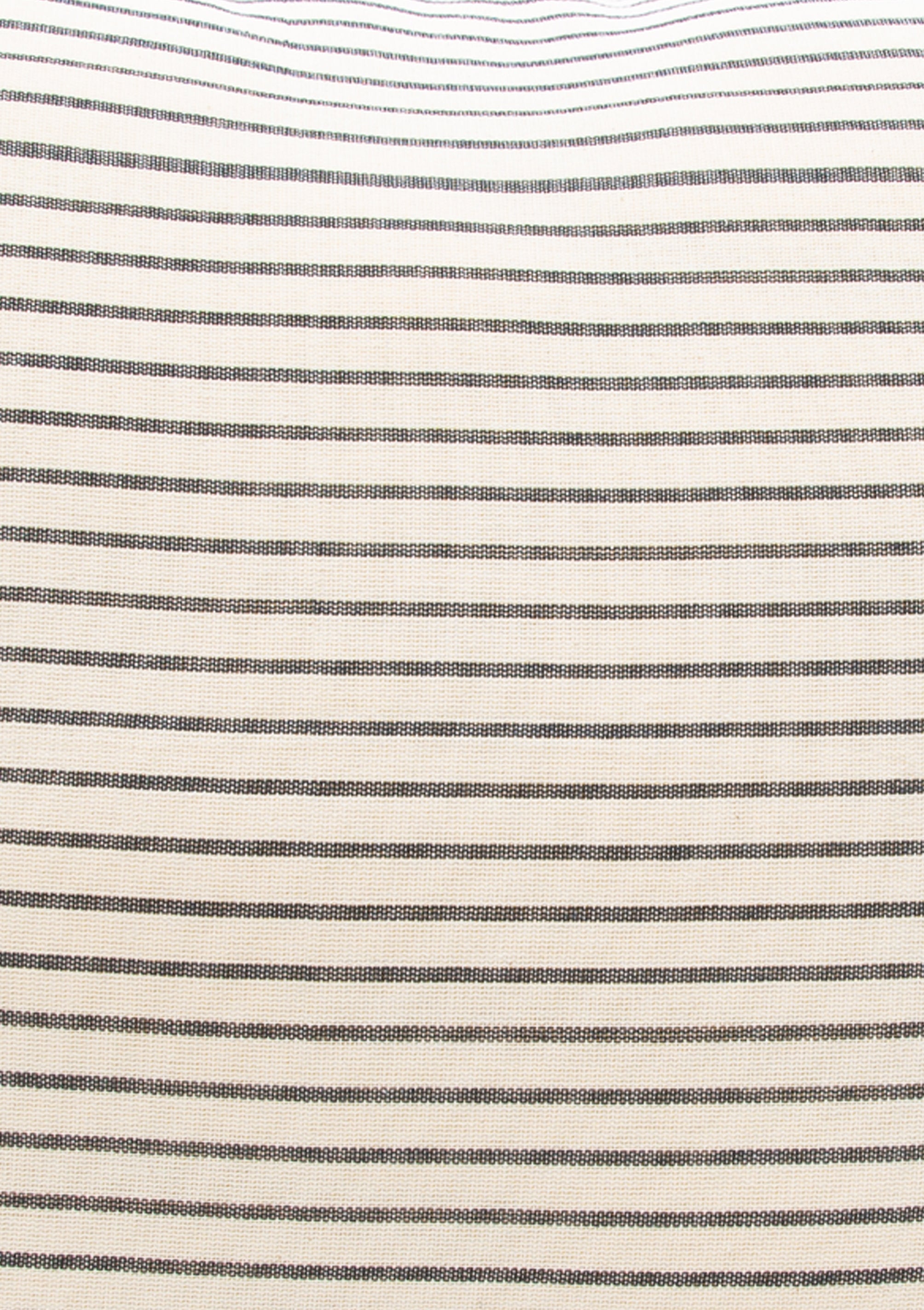 Close up of our striped cotton headboard cushion from Tensira, sustainably made in Guinea by artisan groups using zero-waste practices.
