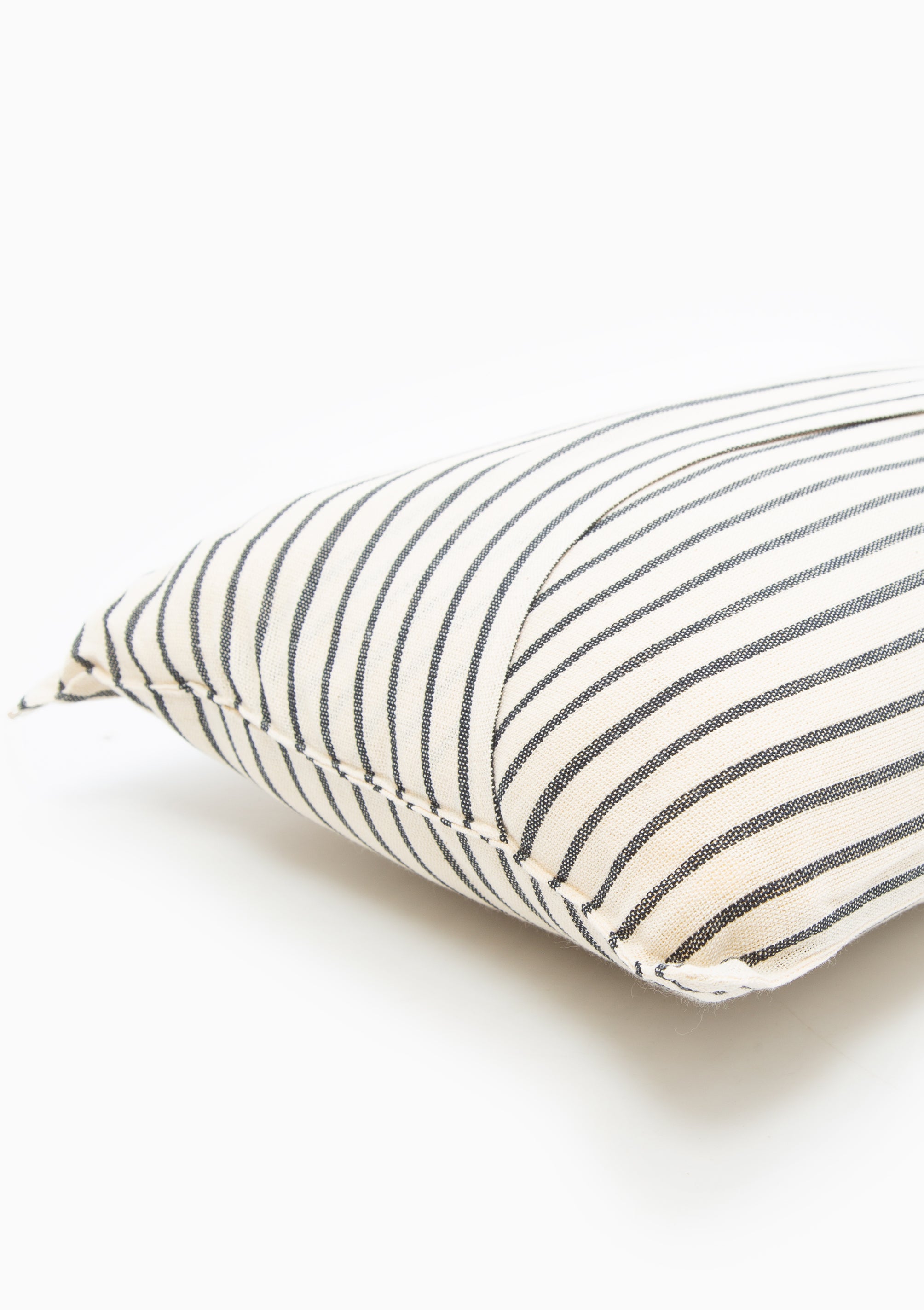 Solid and striped long cushions made from 100% handwoven cotton by Tensira, crafted using traditional looms and sustainable practices.