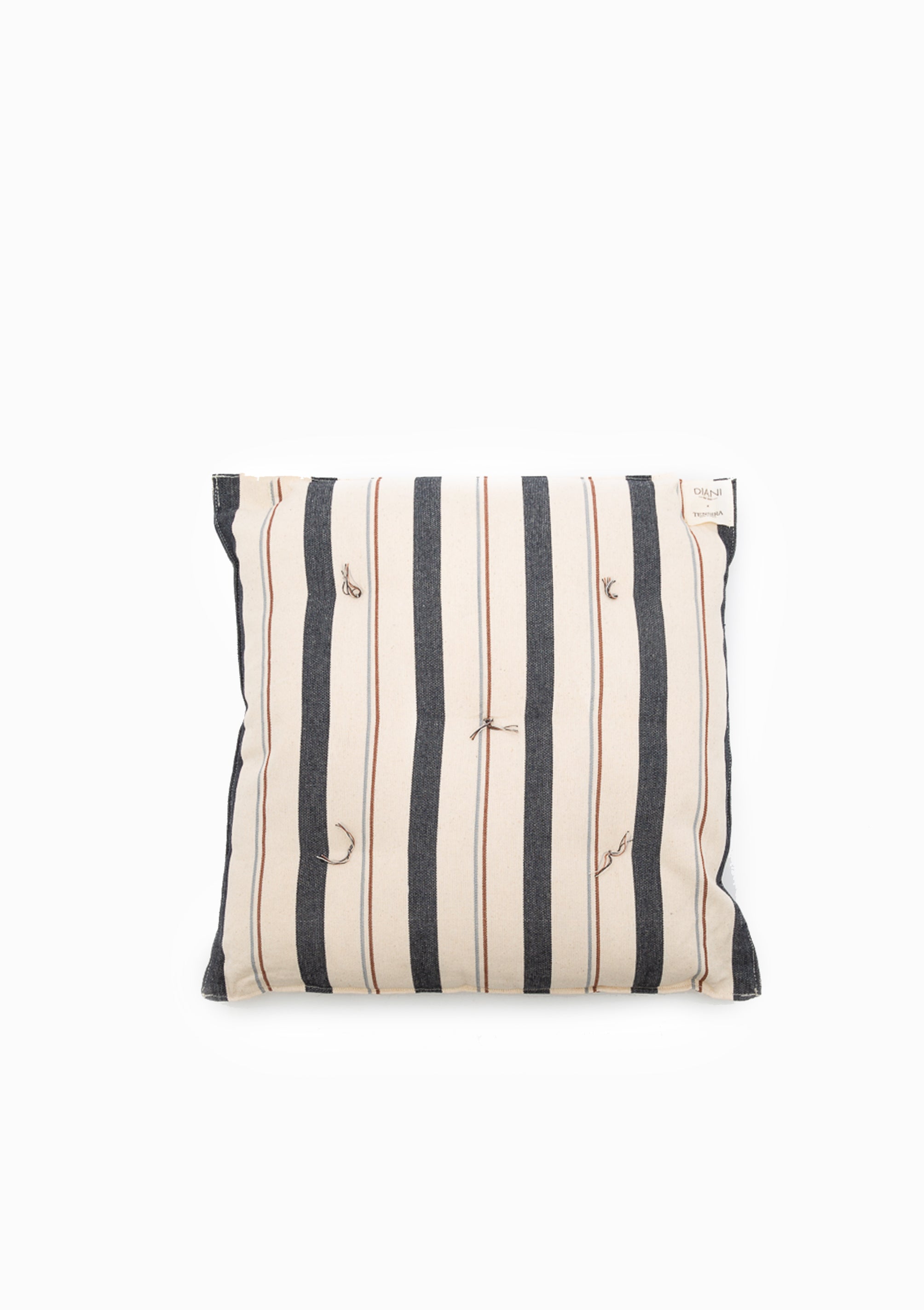 Eco-friendly tufted cushion in a striped design, crafted from hand-dyed cotton by artisans in Guinea for the Tensira x DIANI collaboration.