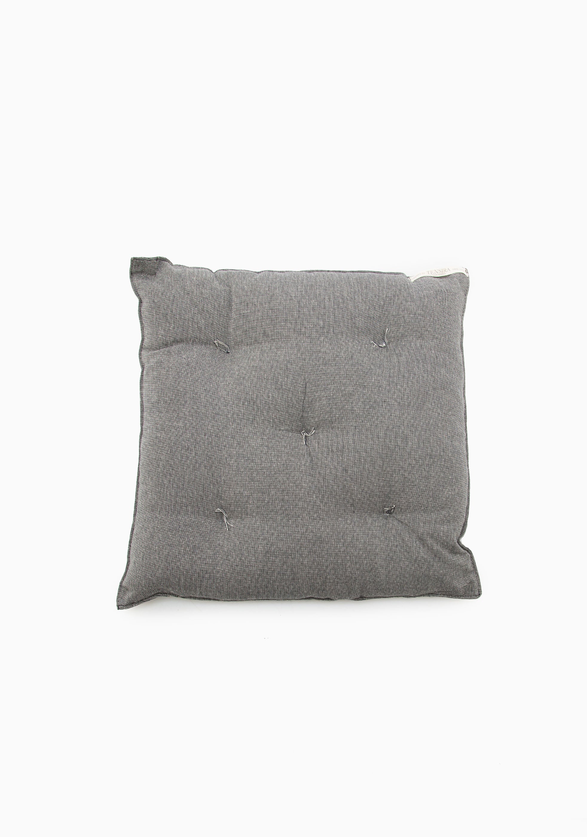 Comfortable and stylish chair cushion with tufted detail, made from over 3,000 hand-wound yarns using zero-waste techniques. Part of our Diani X Tensira collaboration collection.