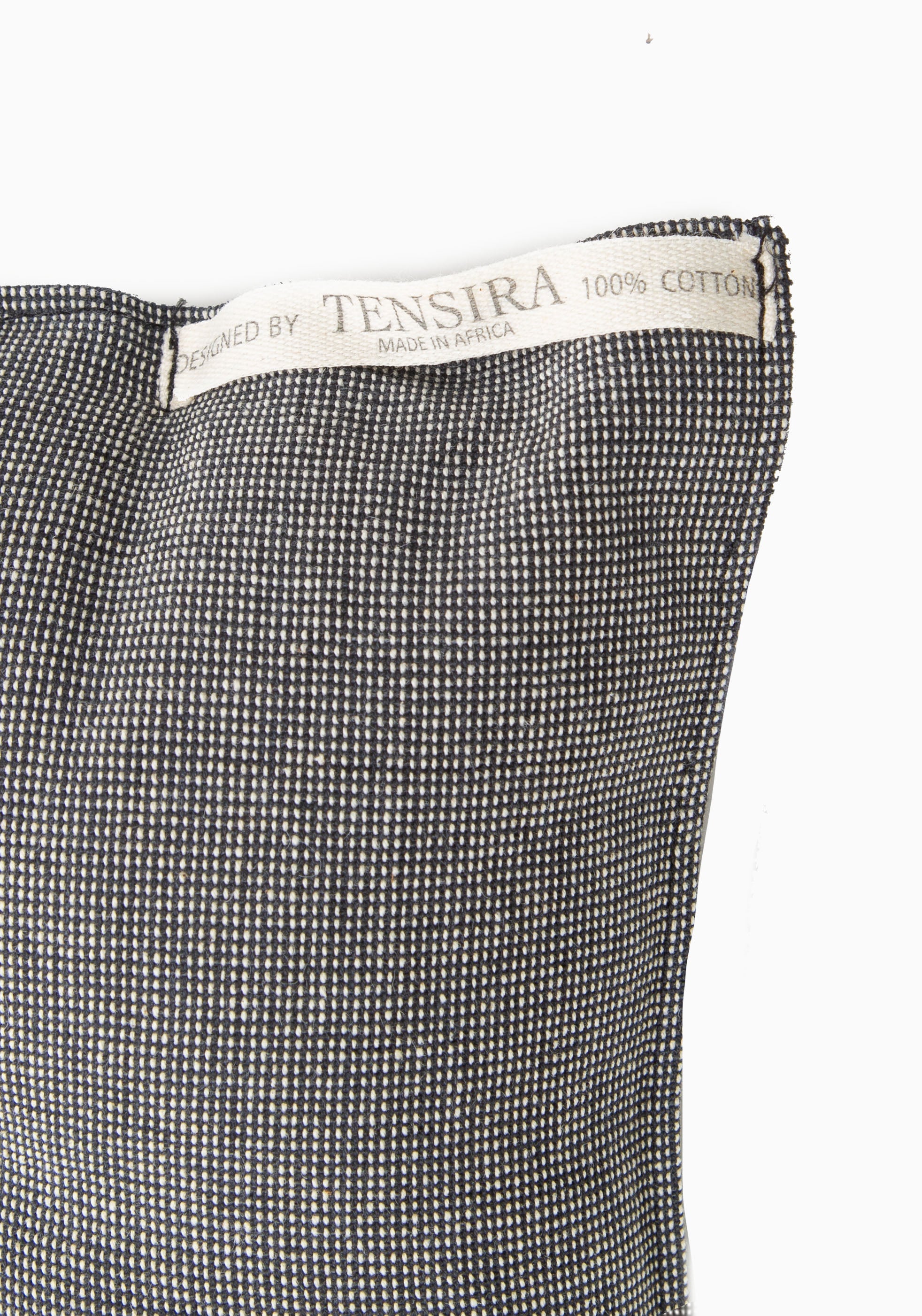 Artisan-crafted tufted cushion with soft cotton texture and sustainable fill, blending traditional African weaving with modern design. Part of our Diani X Tensira collaboration collection.