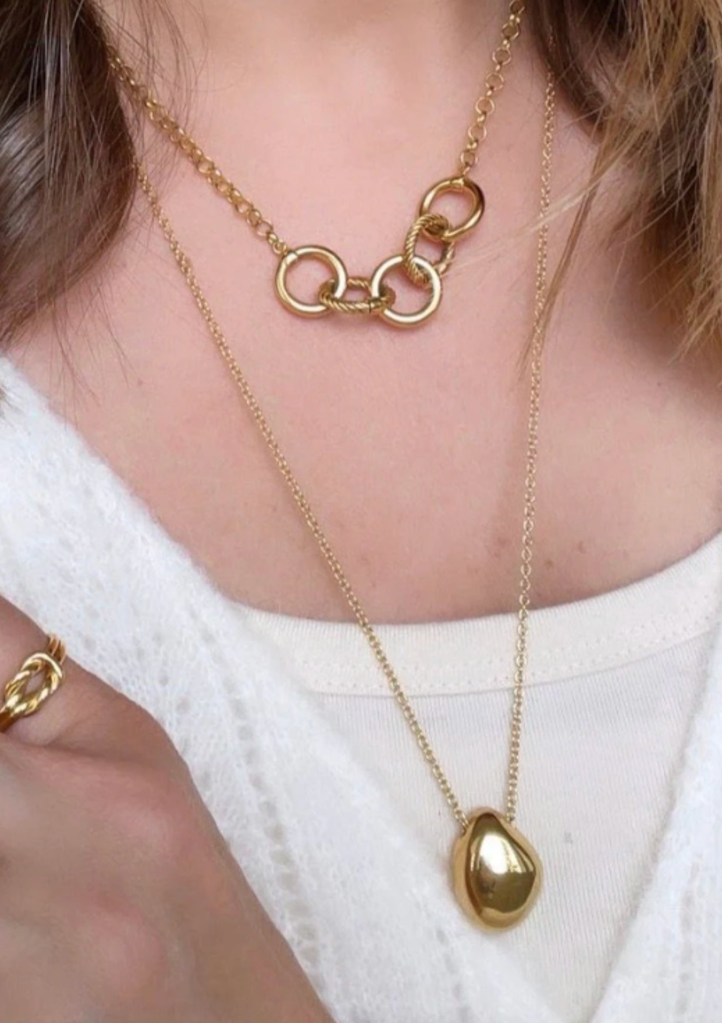 Soko Jiwe Gold Pendant Necklace. Available at Diani.