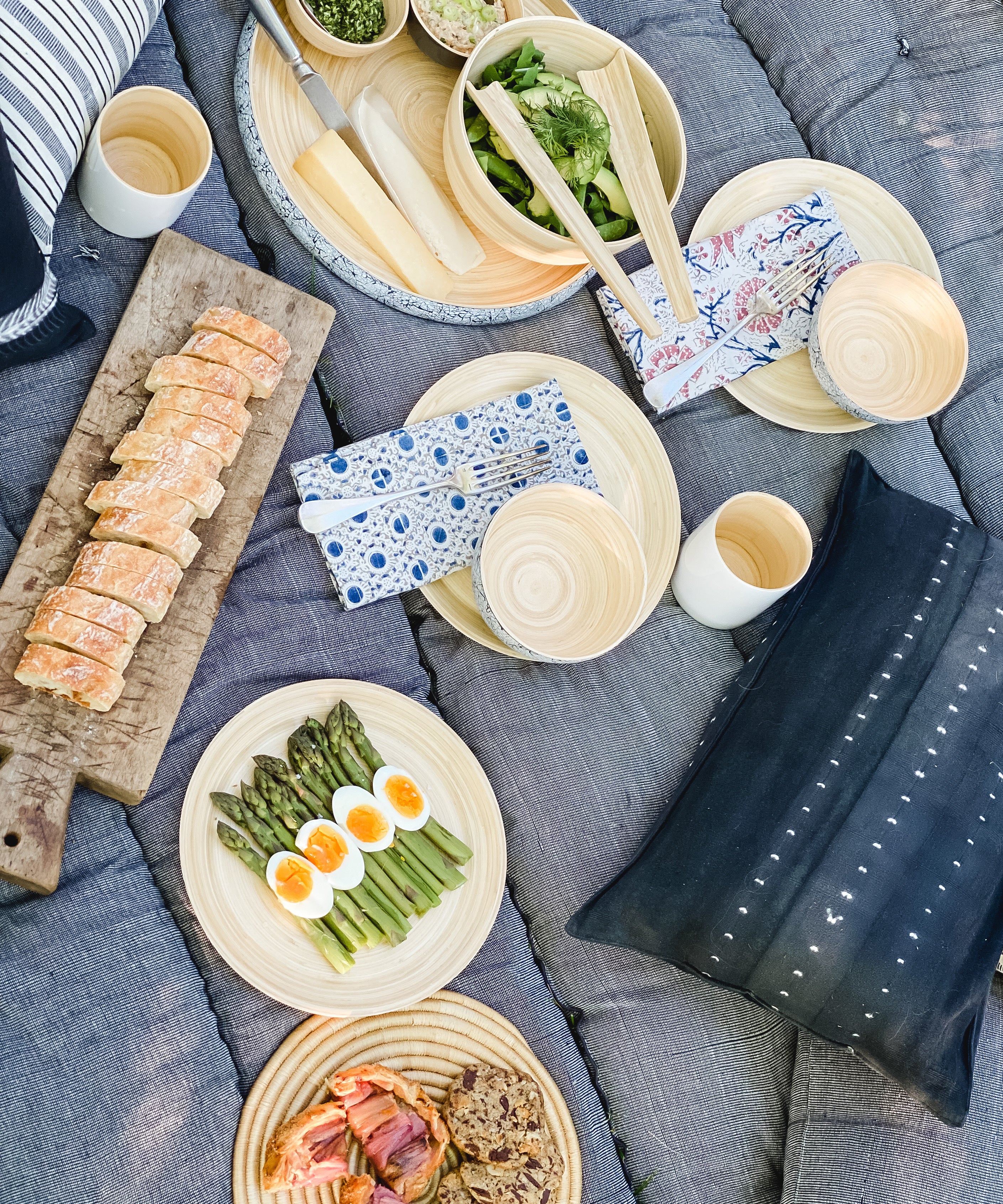 Striped cotton bed roll from the DIANI x Tensira collection, ideal for relaxed garden picnics and sustainable outdoor living.