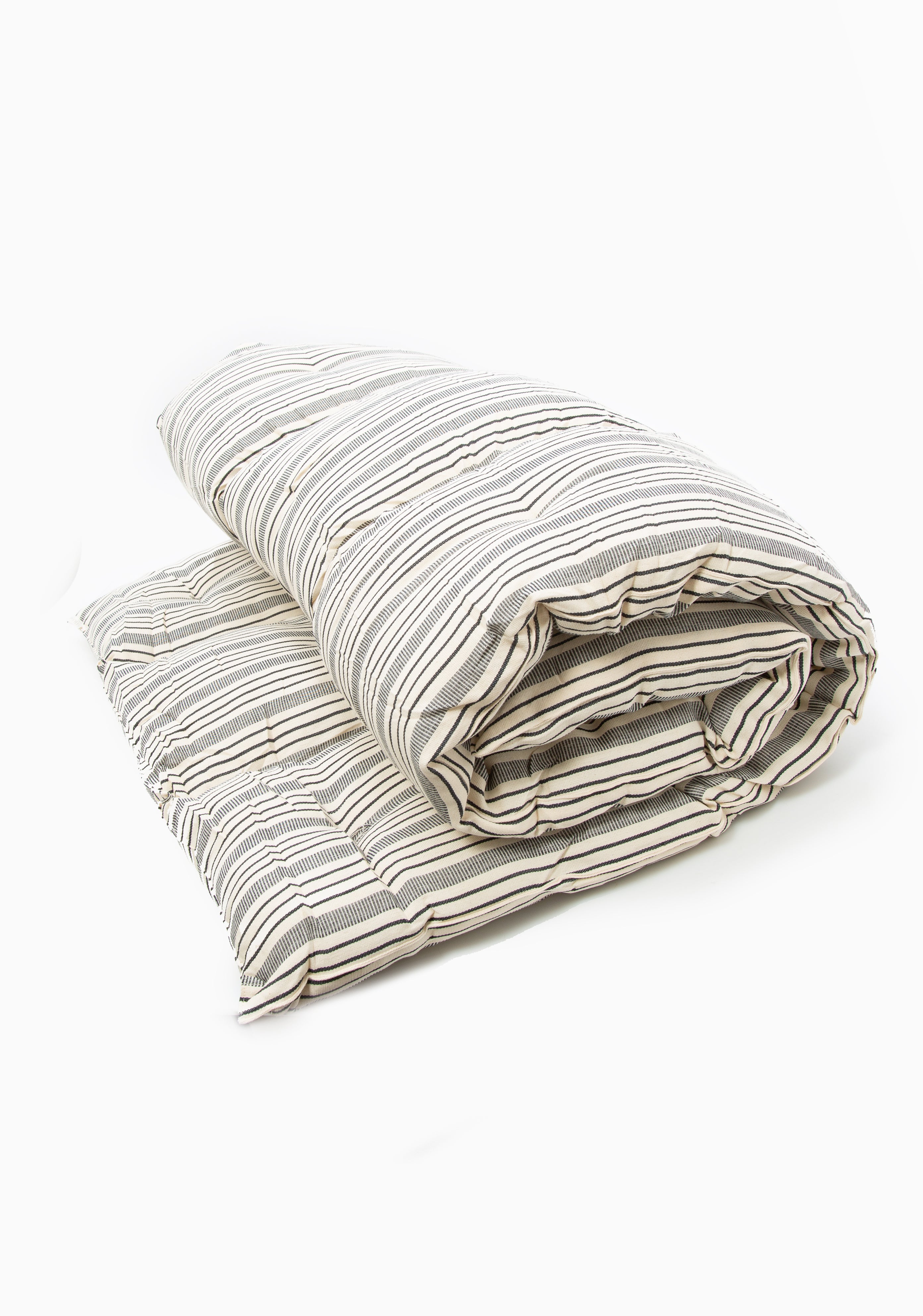 Handwoven picnic bed roll in earthy tones, crafted from 100% cotton by artisans in Guinea for the DIANI x Tensira collaboration.