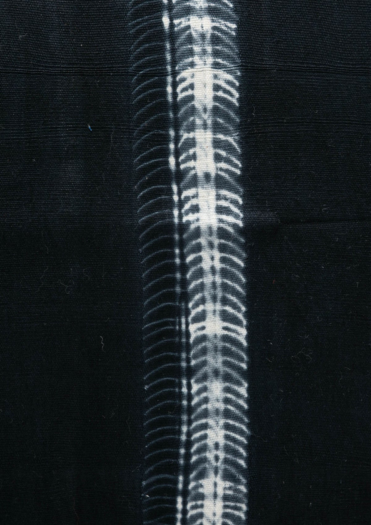 Close up of our navy batik pillow in 20" x 20", crafted from hand-dyed cotton for a bold yet timeless accent.