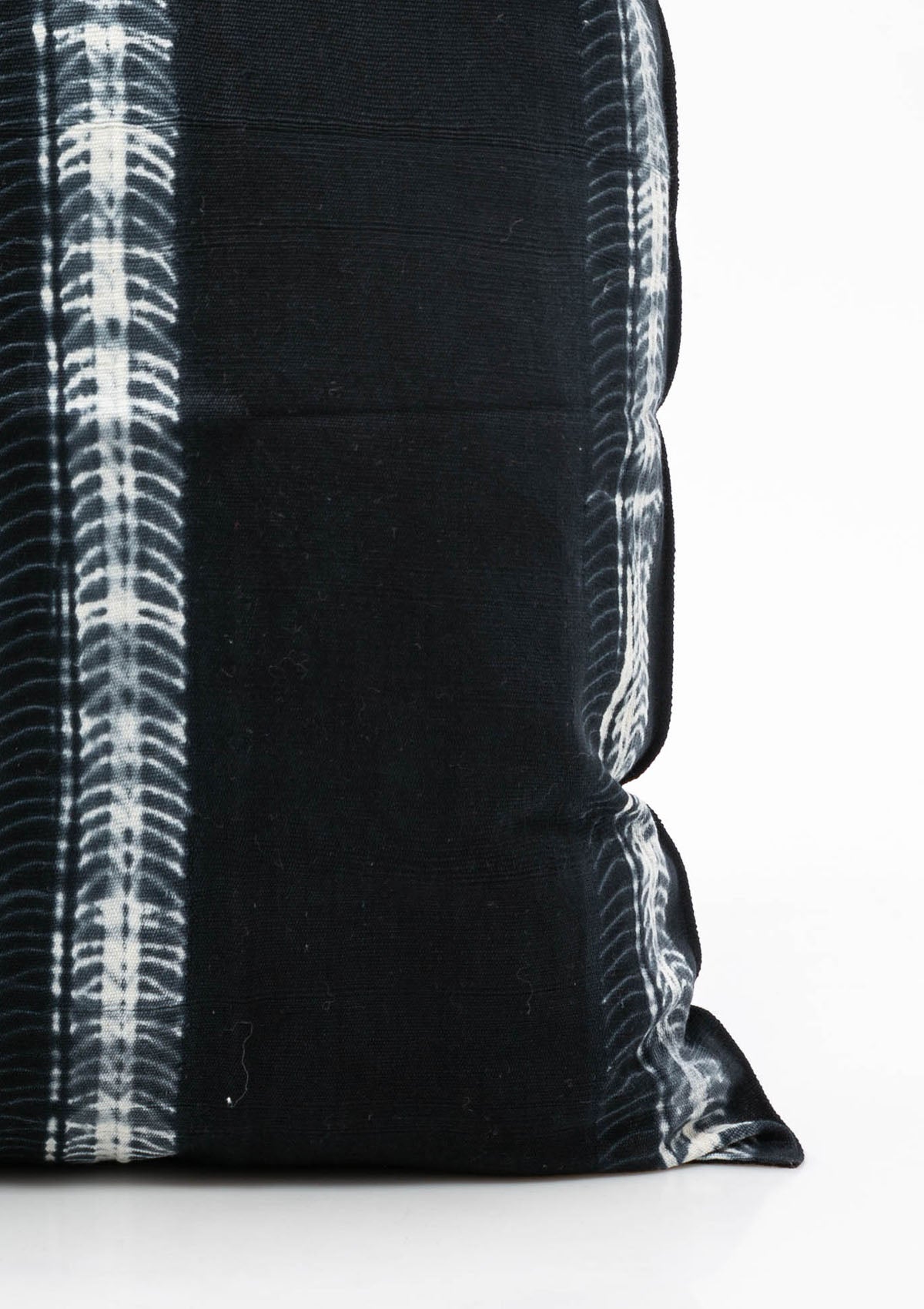 Close up of our navy batik pillow in 20" x 20", crafted from hand-dyed cotton for a bold yet timeless accent.