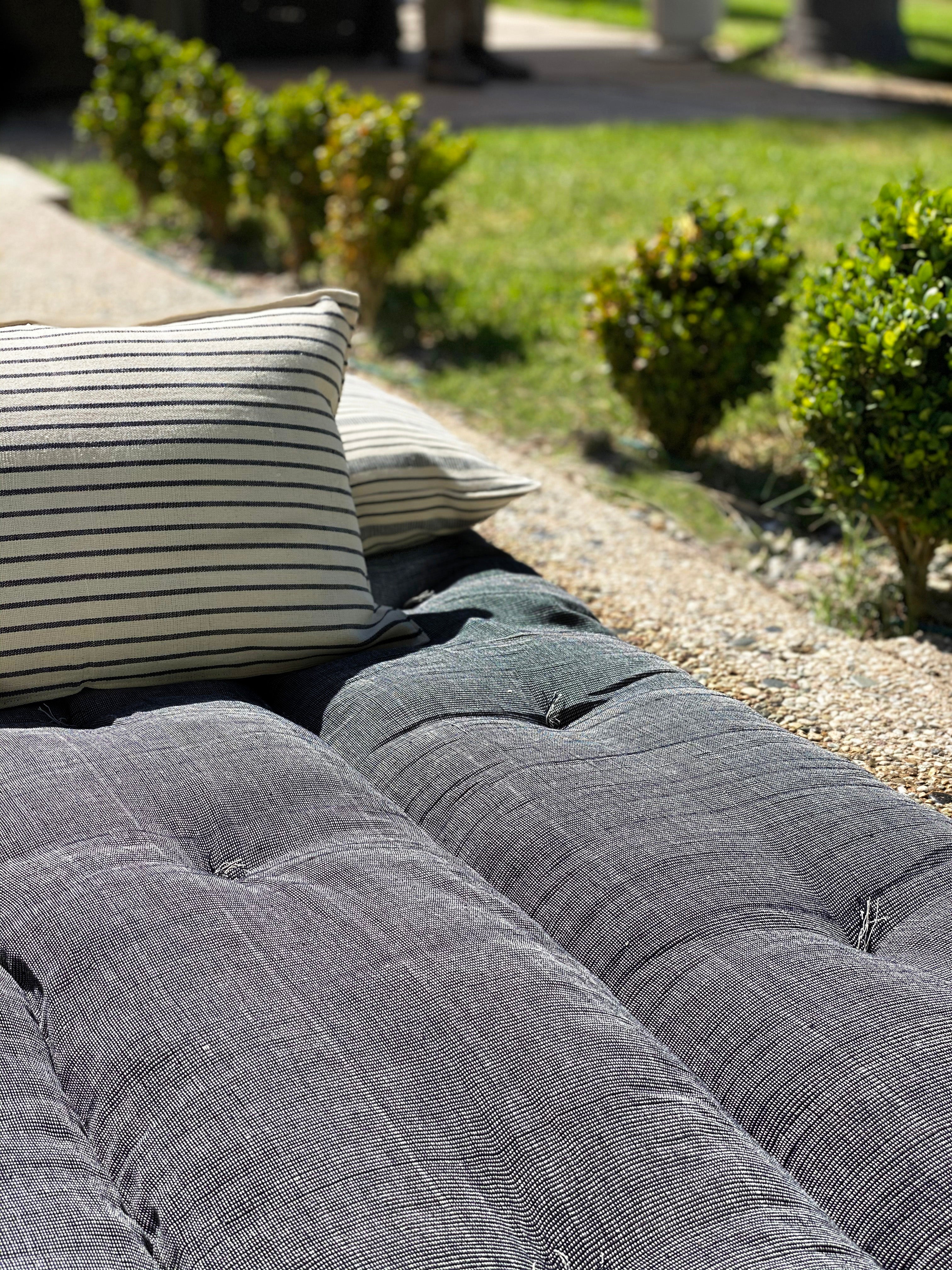 Handwoven picnic bed roll crafted from 100% cotton by artisans in Guinea for the DIANI x Tensira collaboration.