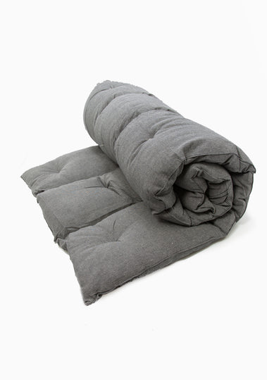 Cotton bed roll from the DIANI x Tensira collection, ideal for relaxed garden picnics and sustainable outdoor living.