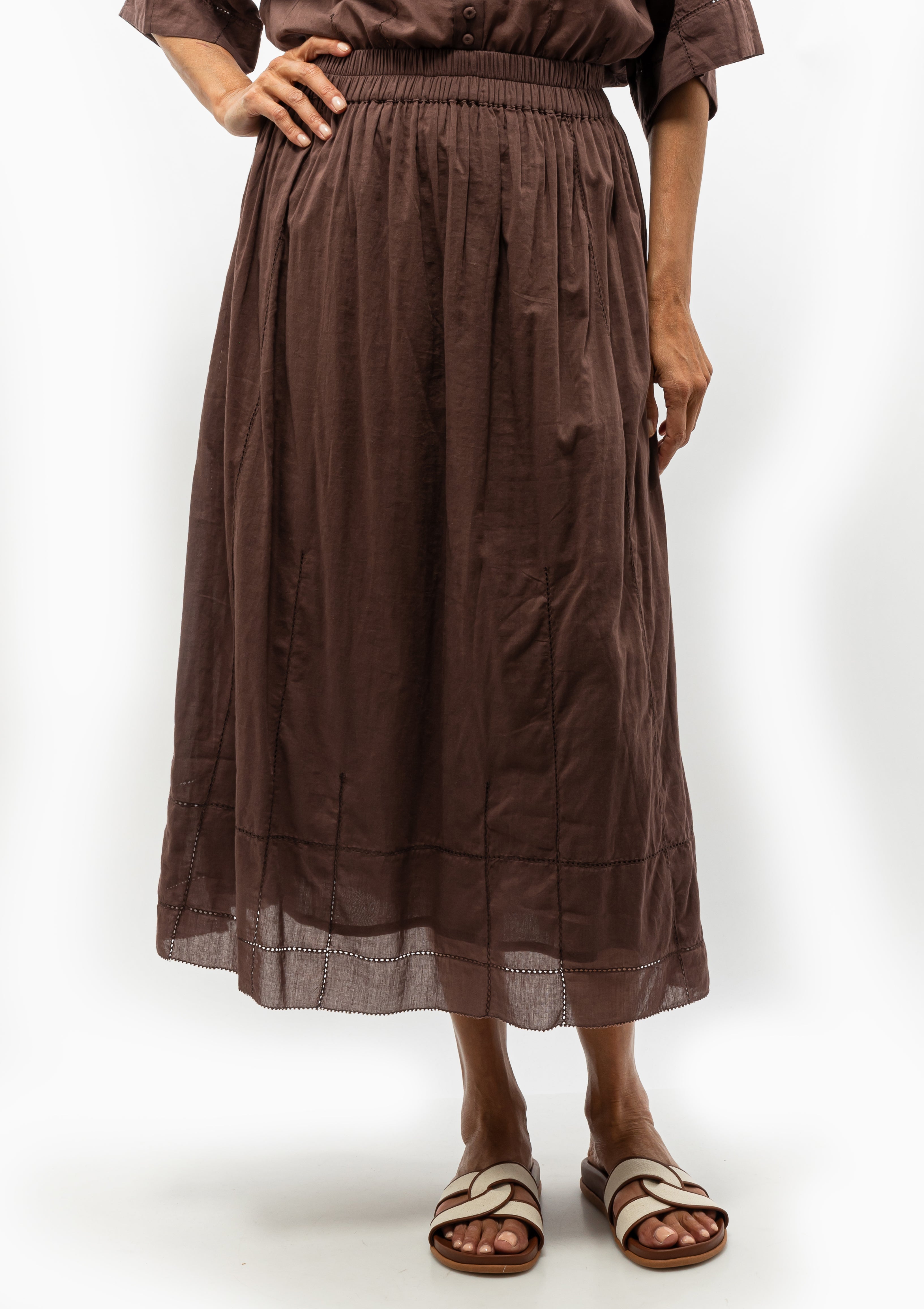 The Mirth Verona Skirt in Grappa brings effortless flair to everyday dressing. Shown with the Mirth Kyoto shirt and the Ancient Greek Sandal Desmos Footbed. Available at Diani Boutique.