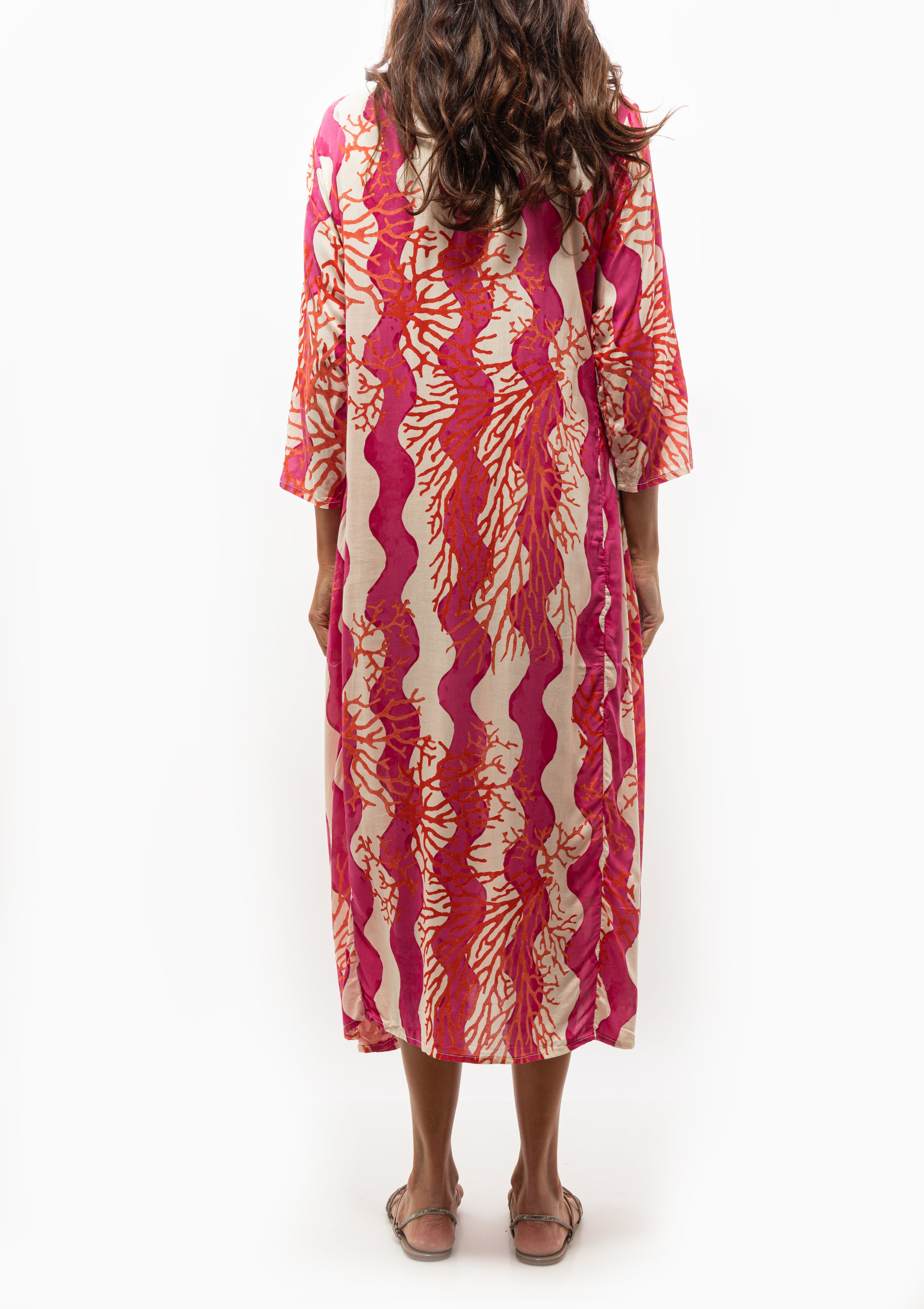 Natalie Martin’s Isobel Dress in bold Coral Wave Fuchsia, styled for warm weather, available at Diani Boutique.