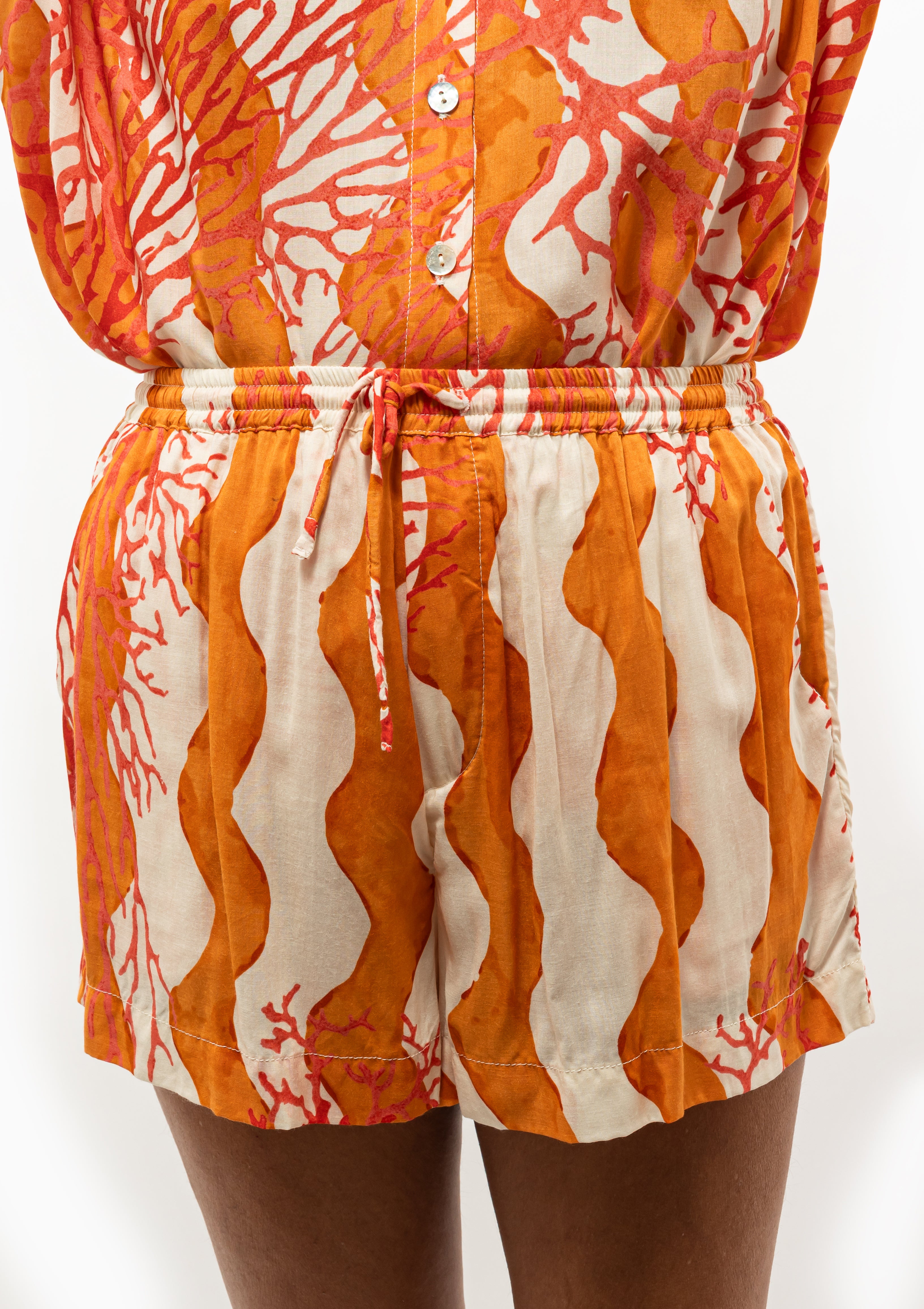 Natalie Martin Jasper Shorts, shown in color Coral Wave Honey in lightweight cotton fabric, available at Diani Boutique