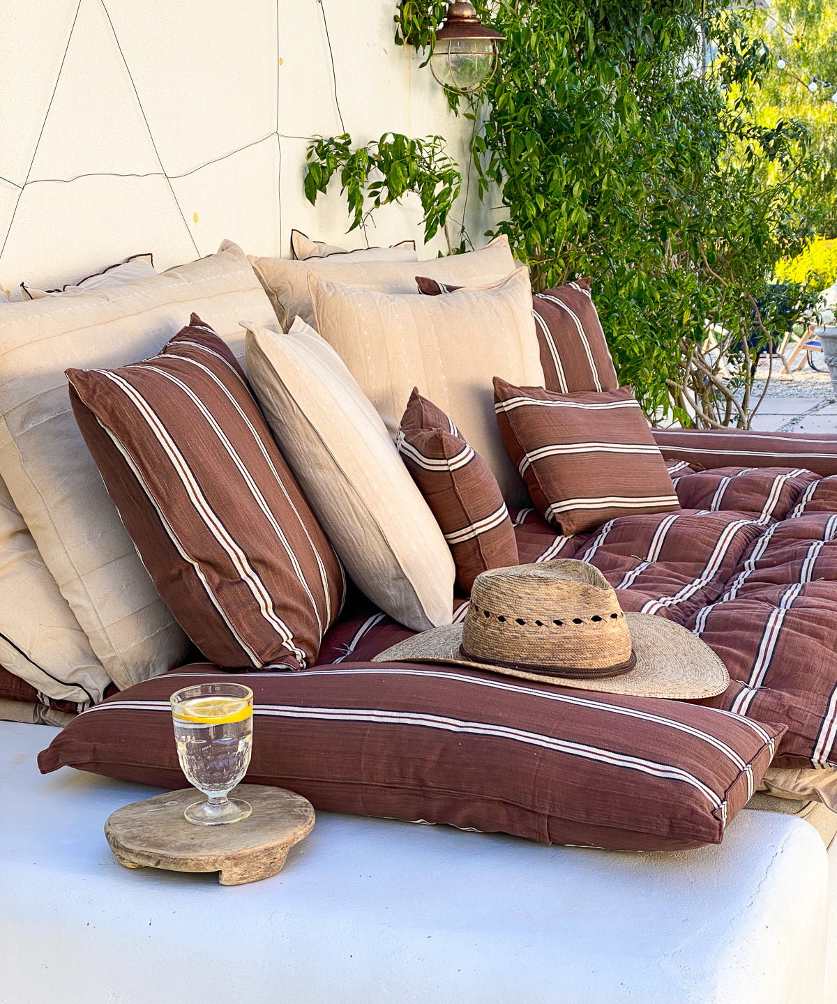 Inspired by safari landscapes, this 12" x 20" striped pillow features handwoven cotton in grounded, natural hues and traditional craftsmanship. Part of the Diani x Tensira Collaboration collection.