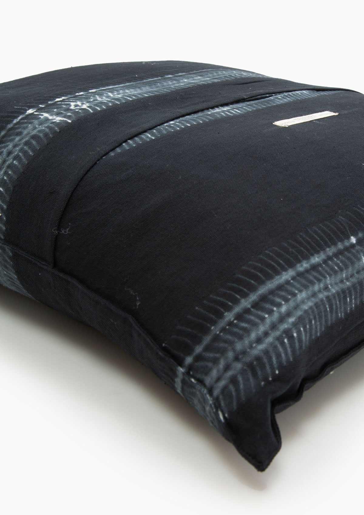 Navy batik pillow in 20" x 20", crafted from hand-dyed cotton for a bold yet timeless accent.