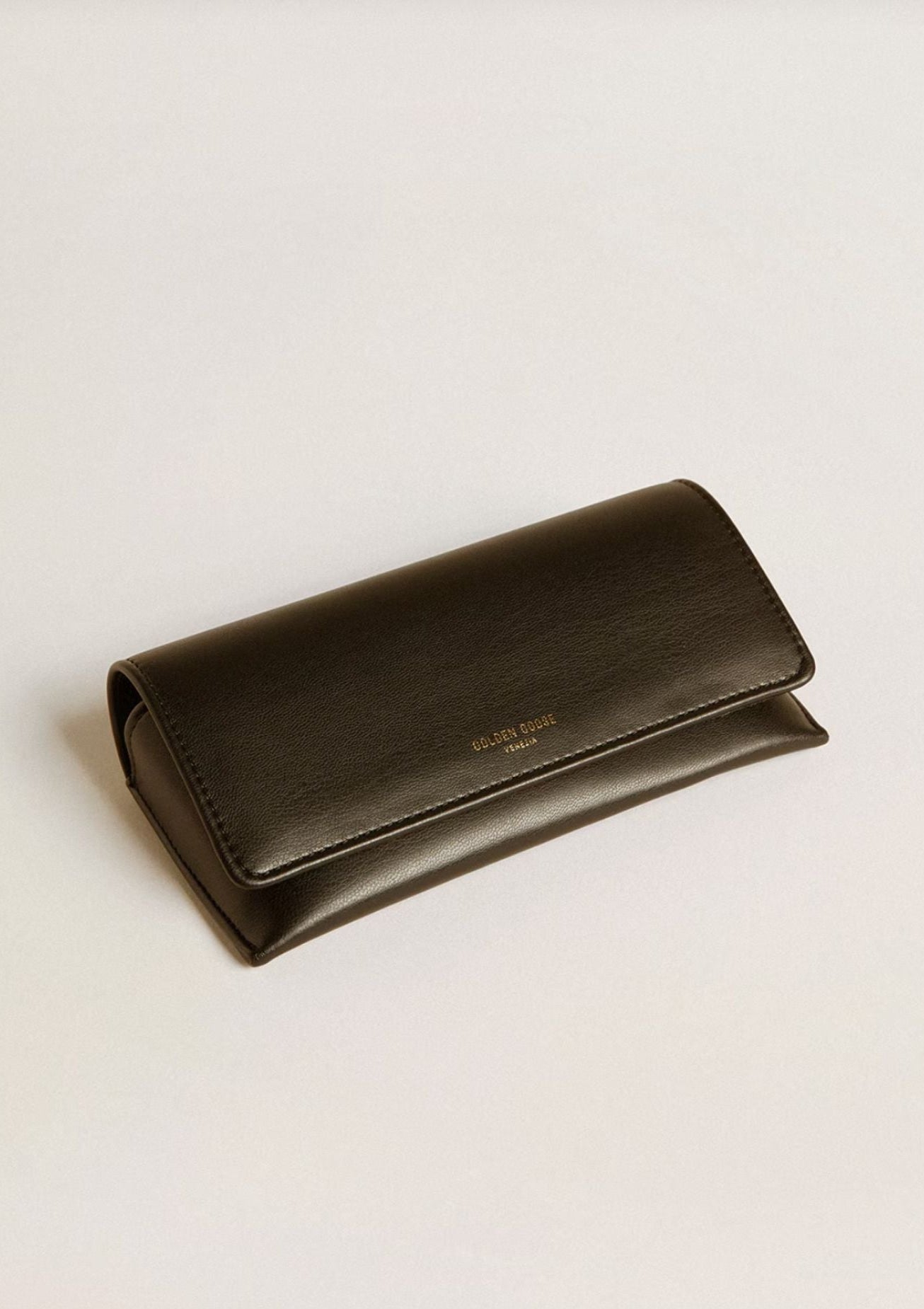 Golden Goose sunglasses case in supple leather hard case. Available at Diani.
