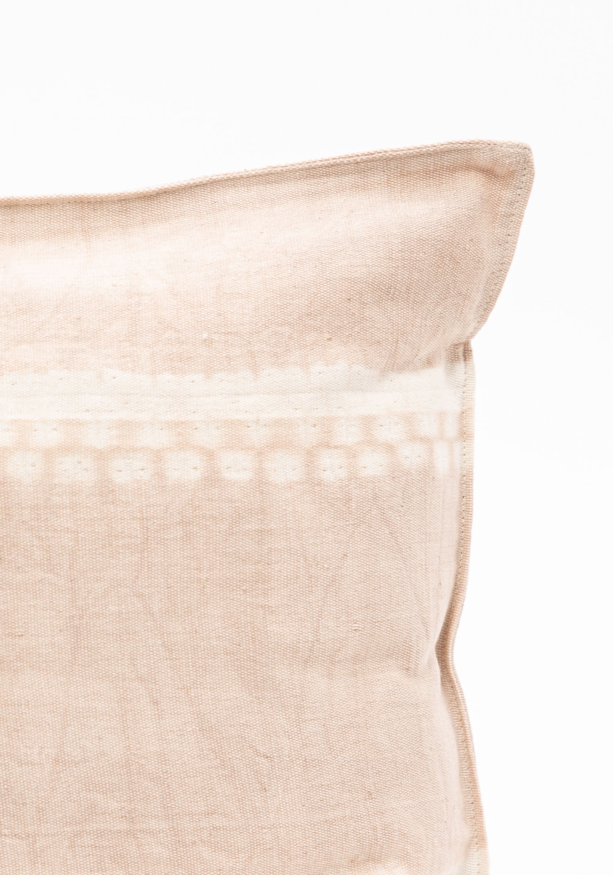 Diani Boutique exclusive rectangular pillow in a mix of solid and striped patterns, made from hand-dyed cotton by Tensira artisans in Guinea. Shown in Taupe Tapik.